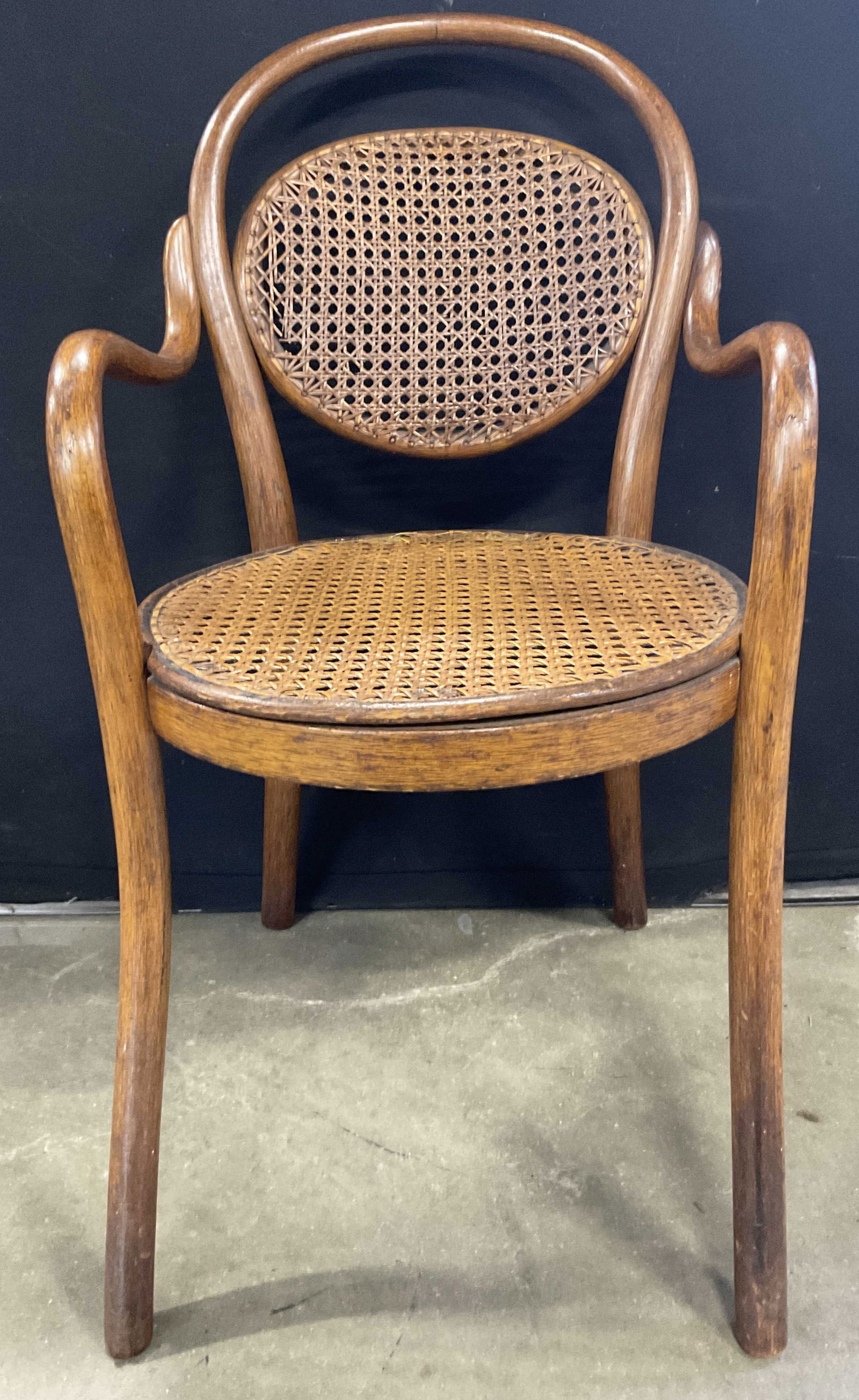 THONET Antique Caned Bentwood Childs Chair: THONET Antique Caned Bentwood Childs Chair. Underside reads THONET. Measures approx. 26H x 15.5W x 13.5D in. Losses, surface wear, and discoloration present. Antiques, antique furniture, furnishings,