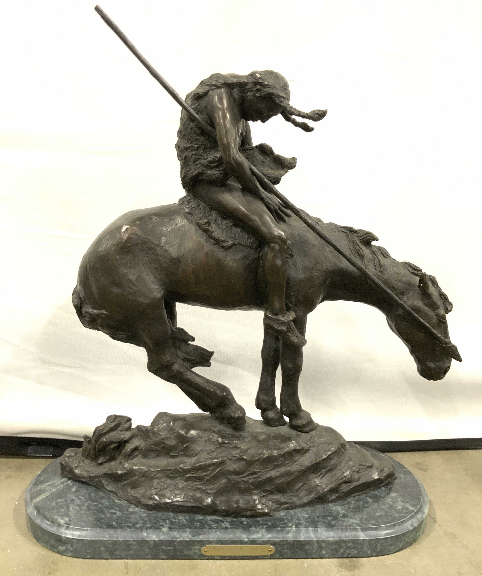 JAMES EARL FRAISER End Of The Trail Sgnd Brnz: Piece & plaque is signed JAMES EARL FRAISER. Piece titled END OF THE ROAD. Depicts a male figure with braids & spear riding a Horse. Piece is solid bronze, and has significant weight. Sits on an oval 