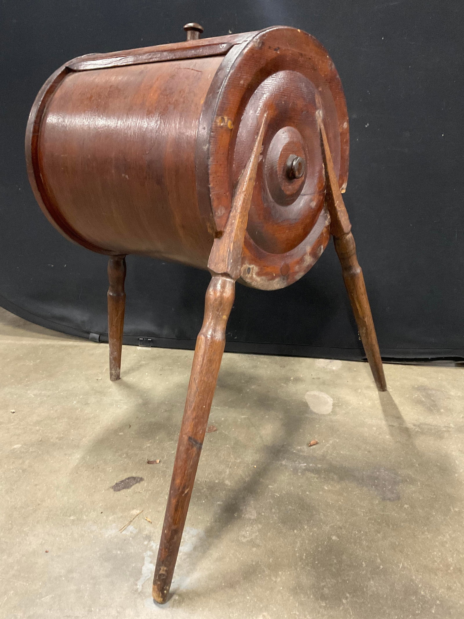 Antq Wood Barrel Form Tripod Leg Butter Churn 29in: Antique Wooden Barrel Form Tripod Leg Butter Churn. Three splayed legs. No interior mechanism. Lidded. Measures approx. 29H x 16D x 26W in. Width measured at legs widest point. Cracking, chipping, los