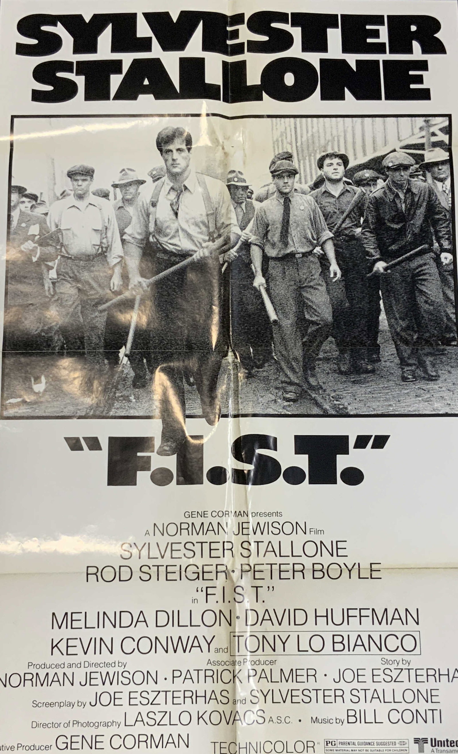 Sylvester Stallone F.I.S.T 1978 Film Poster 40.8in: Sylvester Stallone F.I.S.T 1978 Film Poster Poster from the 1978 film, F.I.S.T starring Sylvester Stallone. Featuring a black & white image of a group of men. Title of the film is in bold letters. Pos