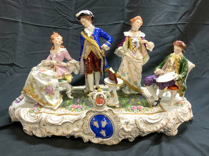 SITZENDORF Vtg Porc Group Of Four Figures 20in: Backside is marked with SITZENDORF Trademark. Piece is vintage. Structure is porcelain, depicts a scene with 2 male and 2 female figures. Front of piece has crown. Piece has gilt scroll and leaf detai