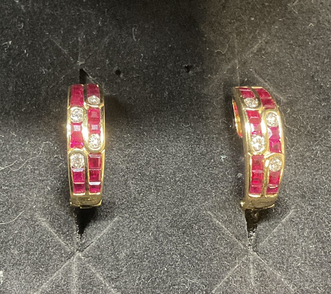 18k Yellow Gold Diamond Semiprecious Earrings: 18k yellow gold earrings with diamond accents and red semiprecious stones. Marked 18k. Measure approx .5 inches long. Total weight 4.3 grams. Includes box. Some wear including scratching observed. Jew