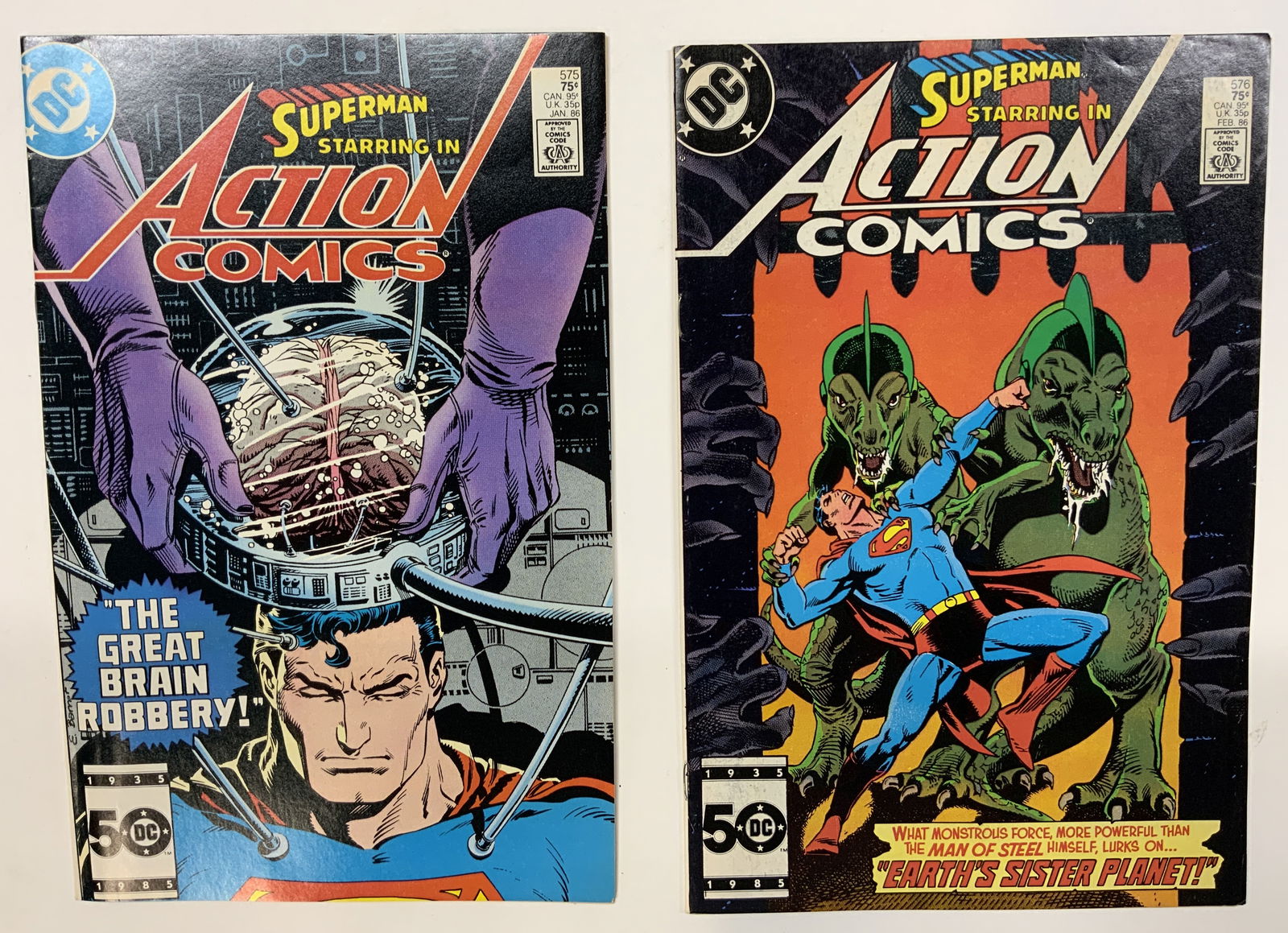 Lot 2 Superman Starring in Action Comics 1985: Lot 2 Superman Starring in Action Comics Illustr. 1985 2 vintage Superman comics including, 1 Superman Starring in Action Comics. Comics #576. Front cover features Superman battling two reptilian crea