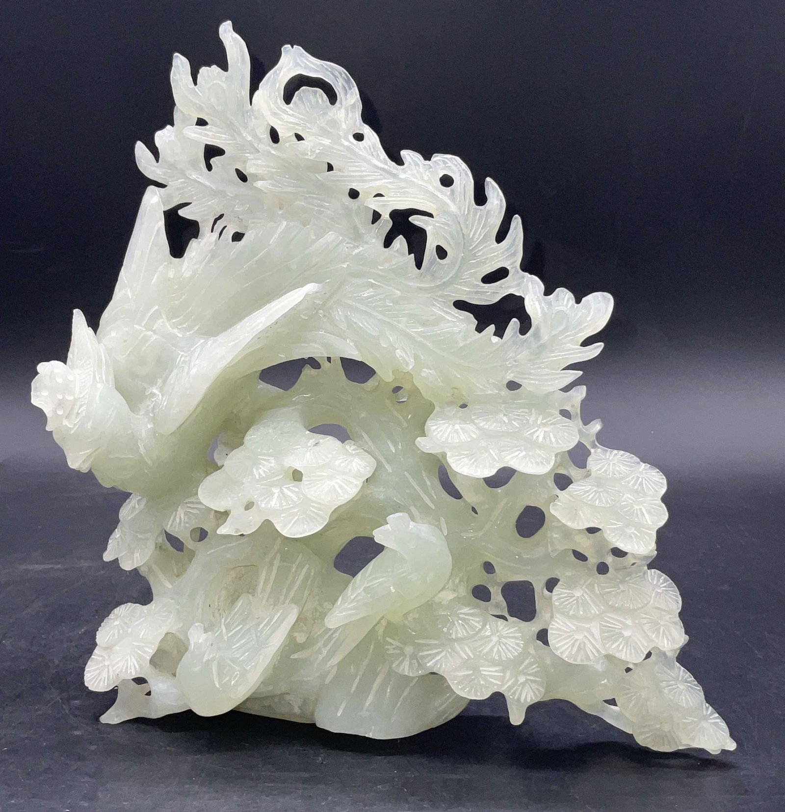 Green Jade Birds Florals Carved Sculpture 7.5in: Green Jade Birds Among Florals Carved Sculpture. Carved and etched details throughout. Measures approx. 7.5H x 7W in. Chipping, losses, surface wear present. Appears to be Jade, possibly another green