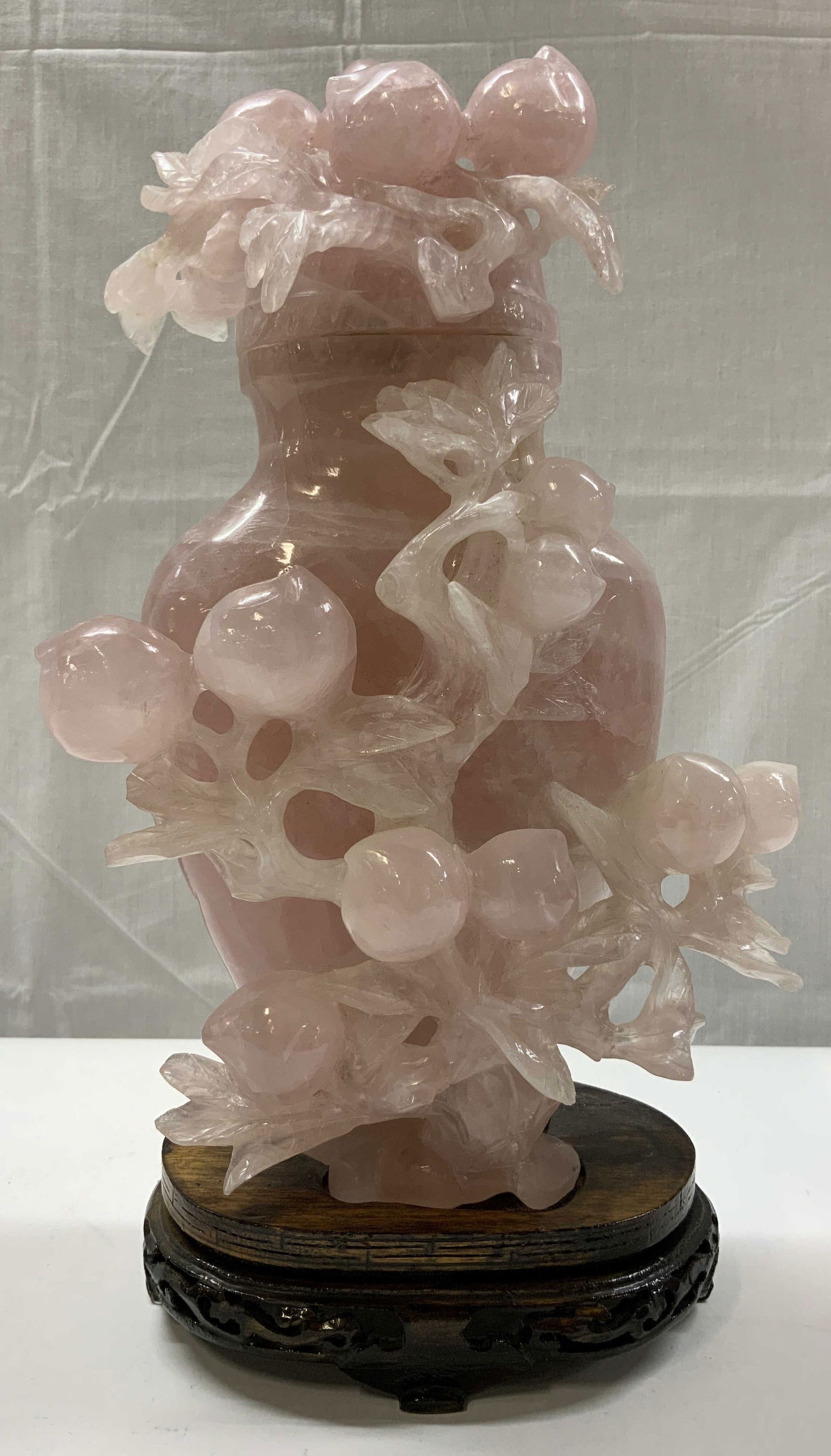 Vntg Pink Jade Urn w Lid & Wooden Stand 13.5in: Vntg Pink Jade Urn w Lid & Wooden Stand Pink jade depicting an urn w a wooden stand thats attached. Urn has a lid. Surface wear consistent to age, use & exposure. Measurements: length 5.5in x width 3.