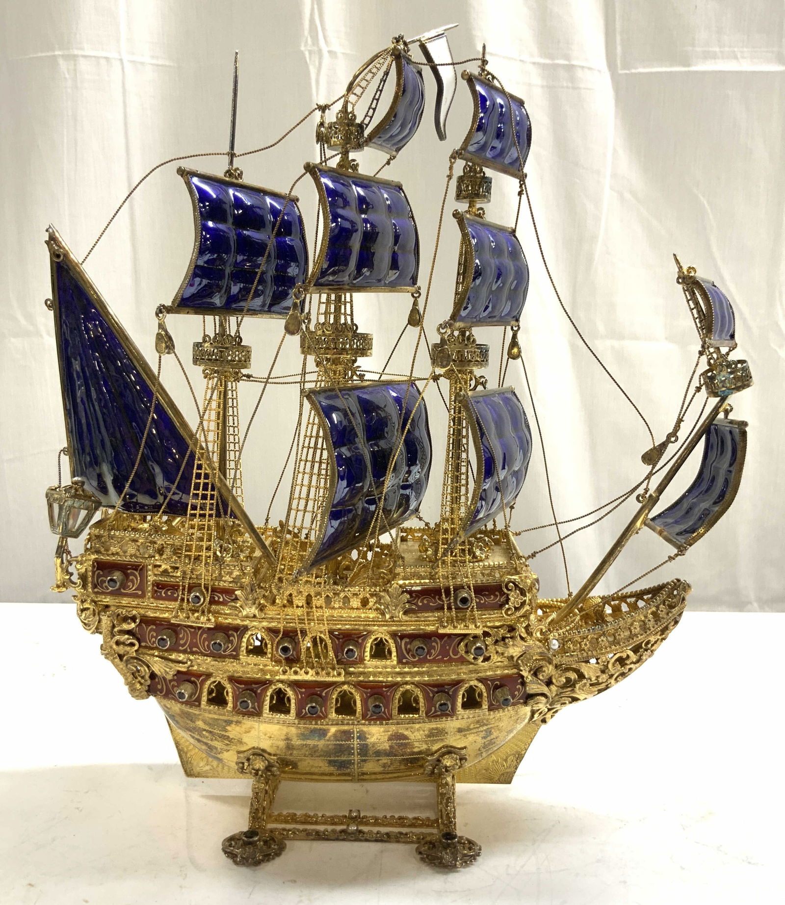 Atq Continental Gilt Metal Enamel & Jwl Mantle Ship: Ship appears to be antique possibly Vintage. Continental Jeweled And Enameled Gilt Metal Galleon. Piece is mounted with pearls and semi precious stones. Piece is gilt metal with cobalt blue & Maroon t