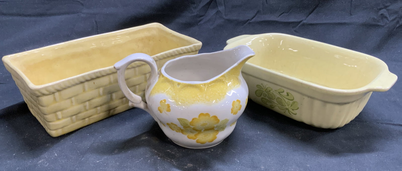 3 Vtg Trdmrkd Ceramicware, Nikko, Cookson & More: Lot includes 1 creamer marked NIKKO IRONSTONE, 1 Planter inscribed COOKSON & 1 serving dish reads FTDA. Planter measures approximately 7.5 inches long 3.5 inches wide 2.5 inches tall. Tabletop accesso