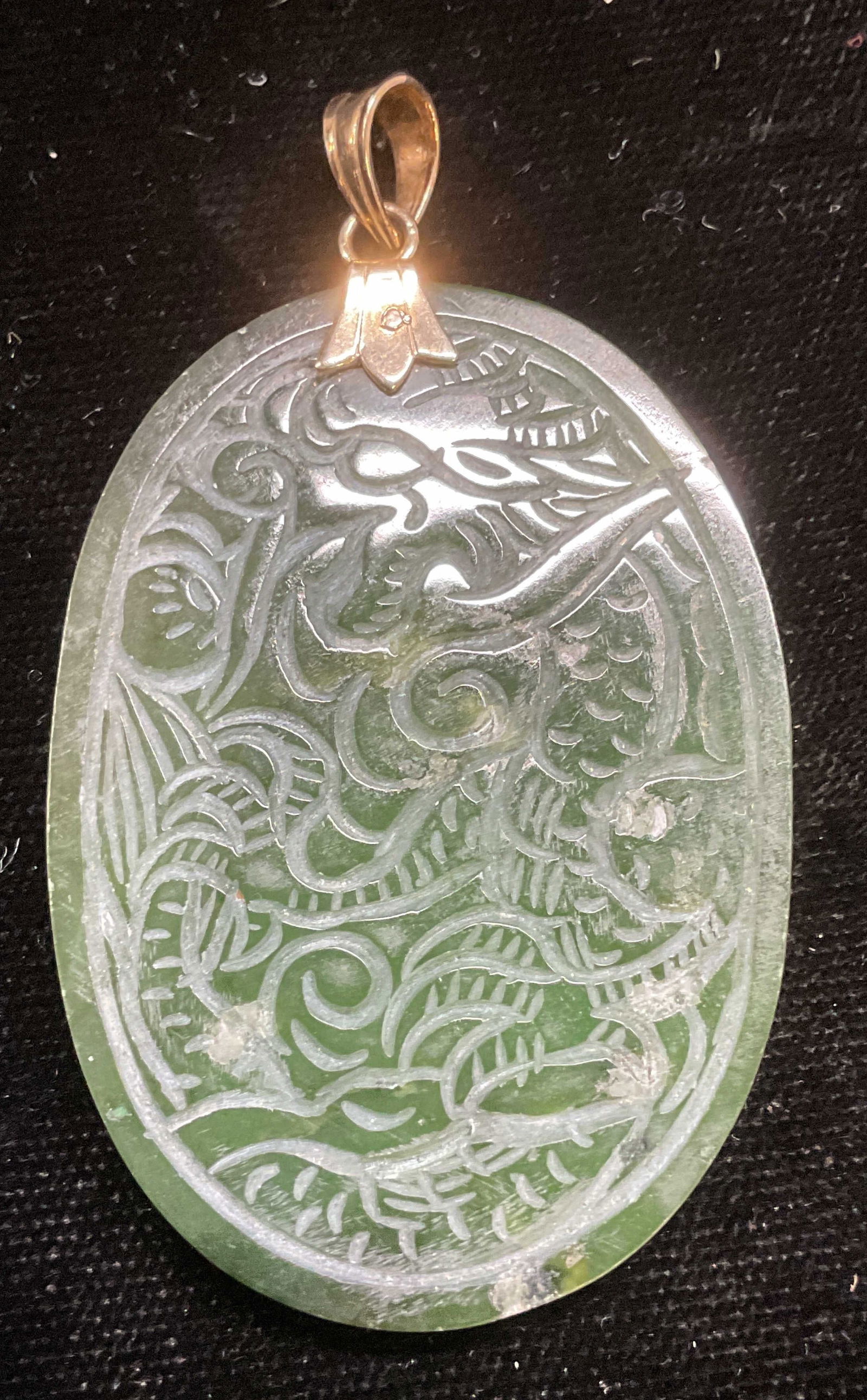 Vintage Carved Asian Jade Dragon Pendant: Vintage hand carved Asian jade dragon motif pendant. Measures approx 2 x 1.5 inches. Some wear including scratching observed. Jewelry, estate jewelry, fine jewelry, cocktail jewelry, fashion jewelry,