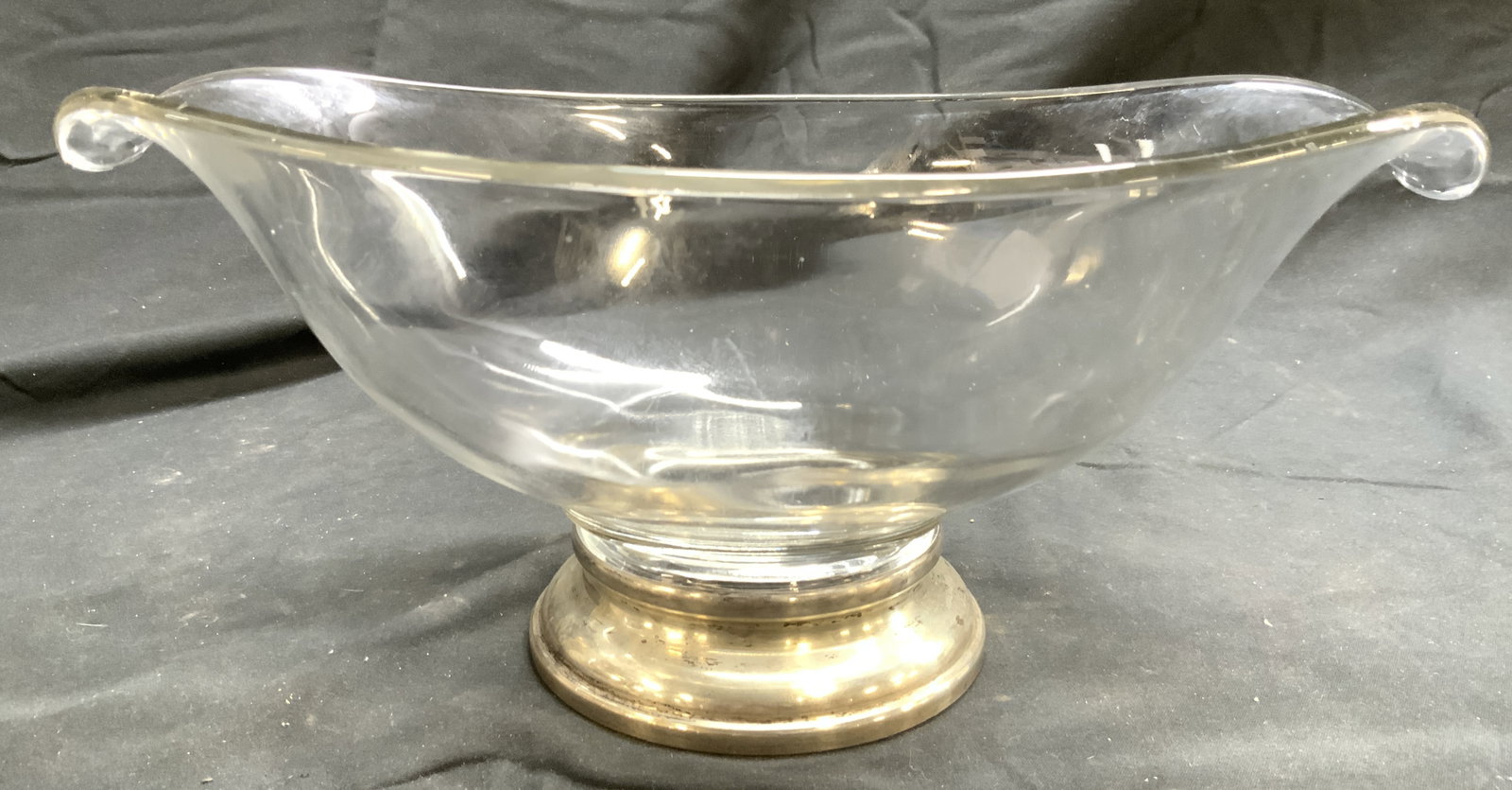 Sterling Silver Base Art Glass Sauce Bowl: Base is inscribed STERLING. Sauce bowl is glass. Piece has spouts at ends . vessel is footed. Piece measures approximately 12 inches long 5 inches tall 7.5 inches deep. Sauce bowl, art glass, vessel, 