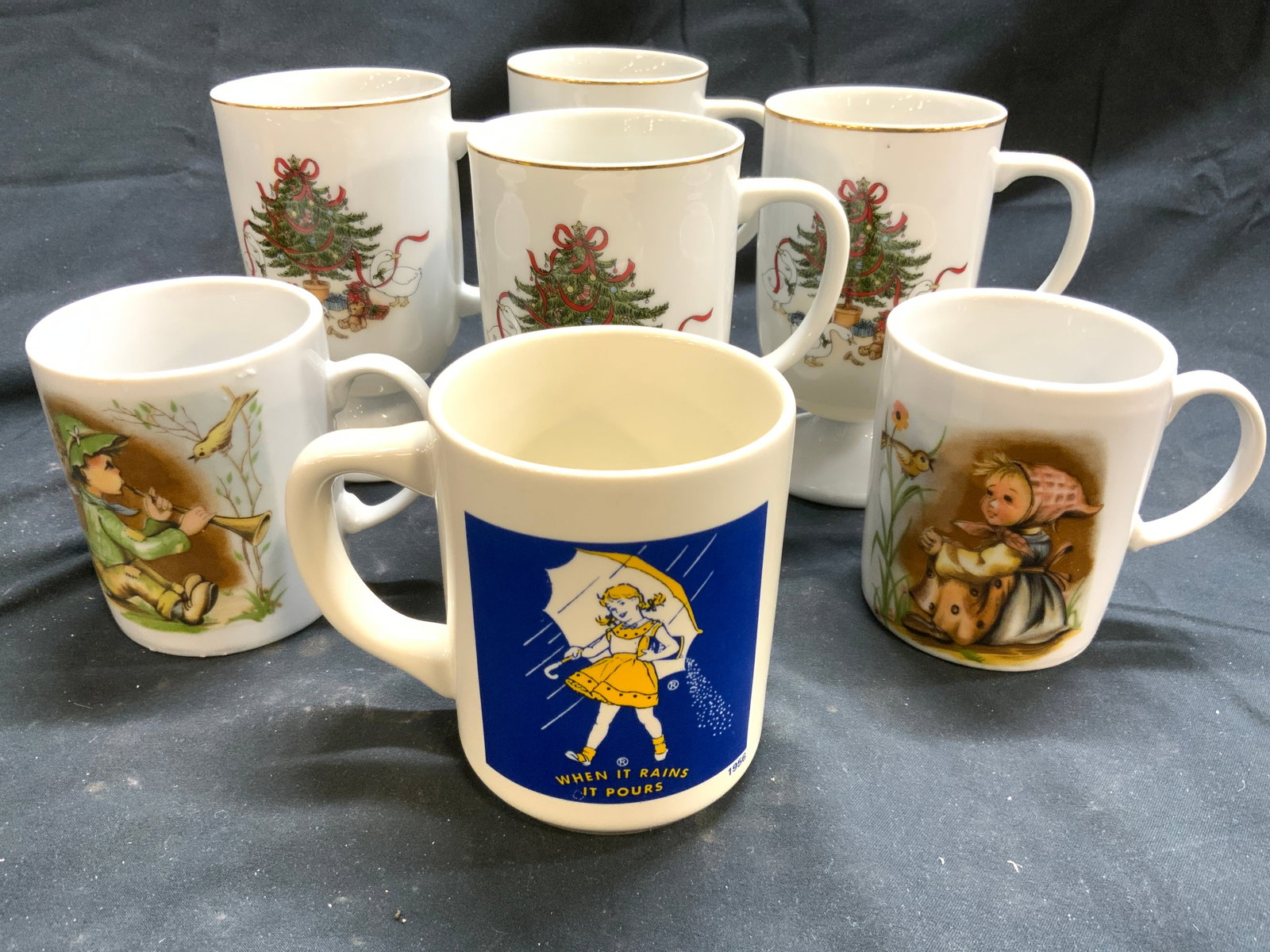 7 Porc Mugs, Morton Salt Girl & Holiday, Japan +: Lot includes 4 Christmas detailed footed vessels, marked Japan on undersides, 2 coffee mugs (1 with boy, 1 with girl figure) & 1 coffee mug with Morton Salt Girl, sticker on underside reads made in Ja