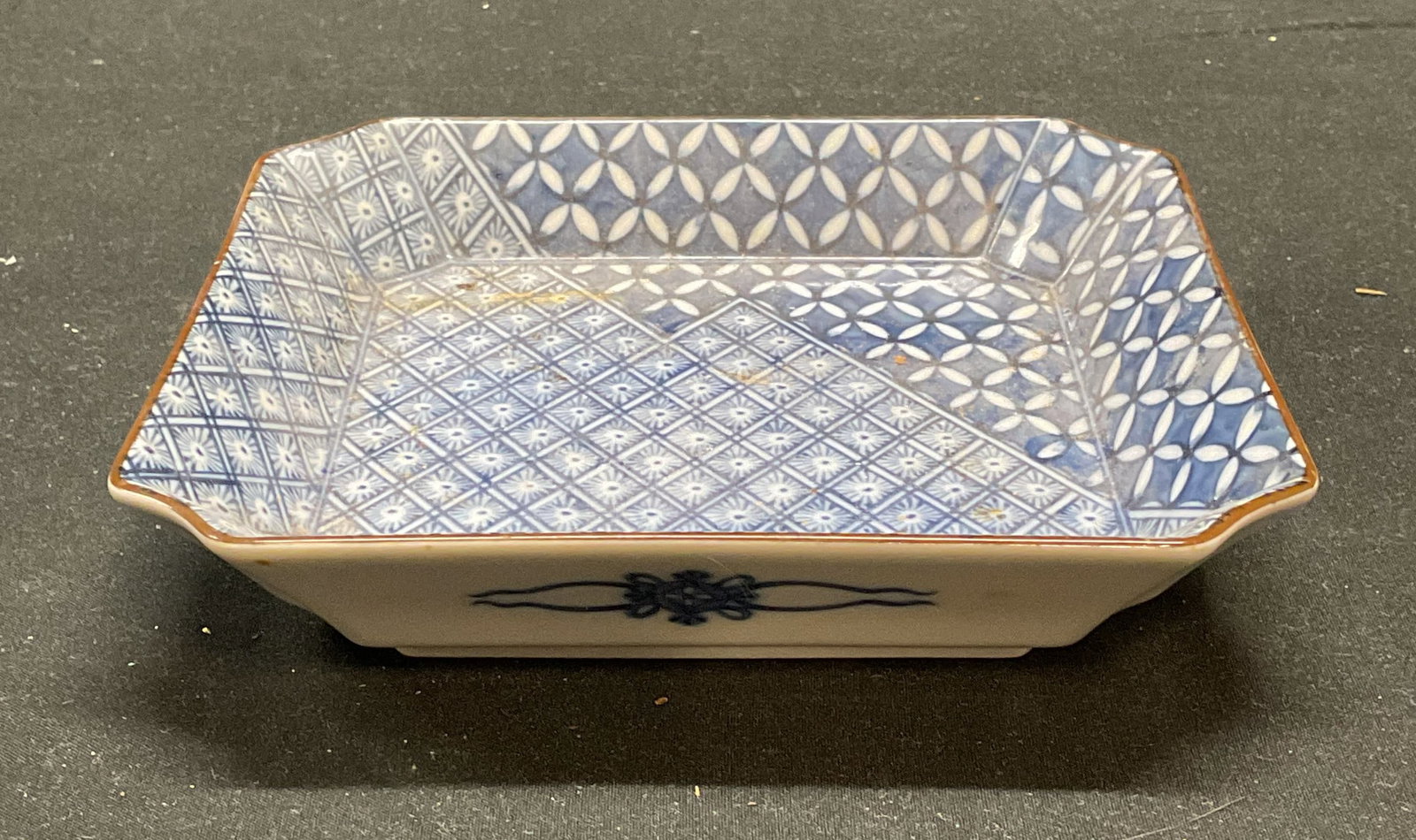 Signed Chinese Porcelain Blue & White Dish: Signed Chinese porcelain dish in blue and white with geometric floral pattern. Signed on underside. Measures approx 6 x 6 x 1.25 inches. Some wear including scratching observed. Porcelain dish, Chines