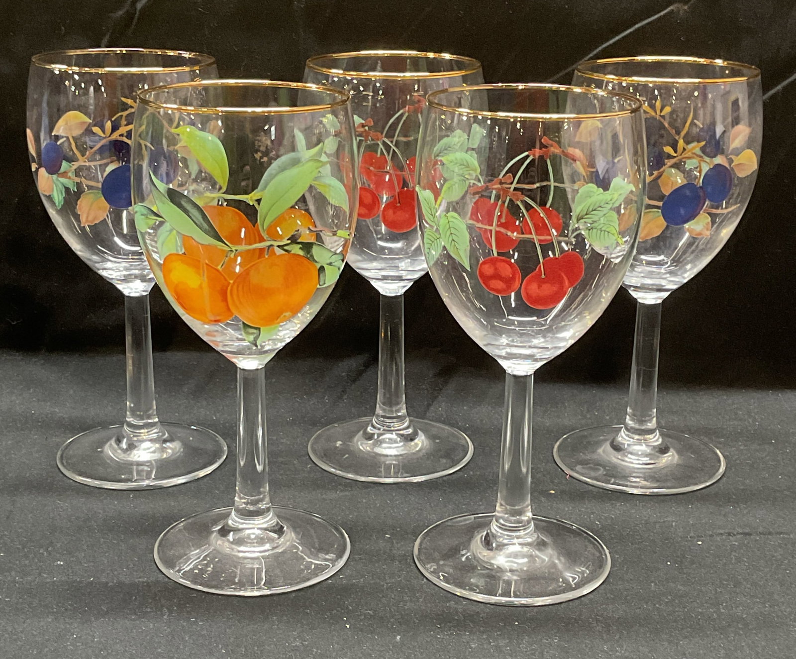 Set 5 Fruit Motif Wine Glasses Stemware: Set of 5 clear wine glasses with fruit motifs. Cherry, blueberry, and orange. Measure approx 3.25 x 7.5 inches. All pieces have some wear including scratching. Wine glasses, stemware, Barware, tablewa