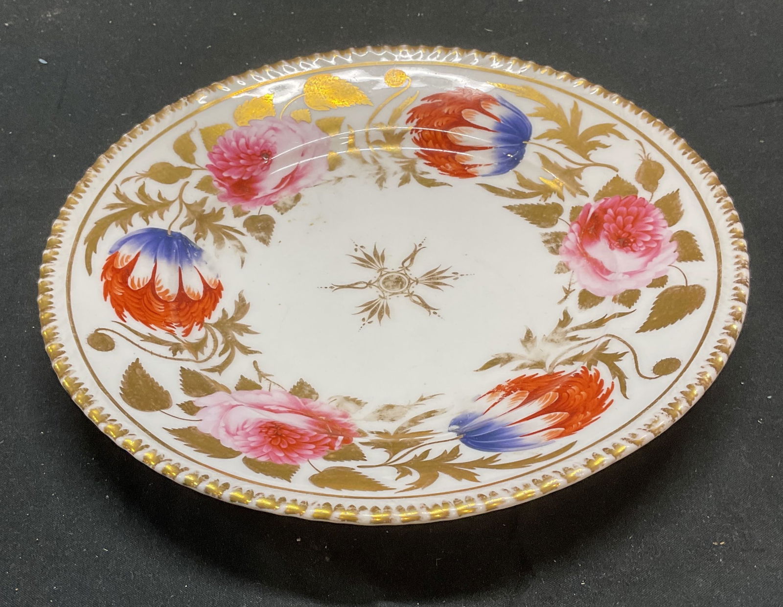 Vintage Hand Painted Gilt Floral Porcelain Plate: Vintage porcelain plate, hand painted floral pattern and gilt decoration. Measures approx 8.5 inches wide. Wear including scratching and loss to paint. Floral plate, gilt plate, porcelain plate, table