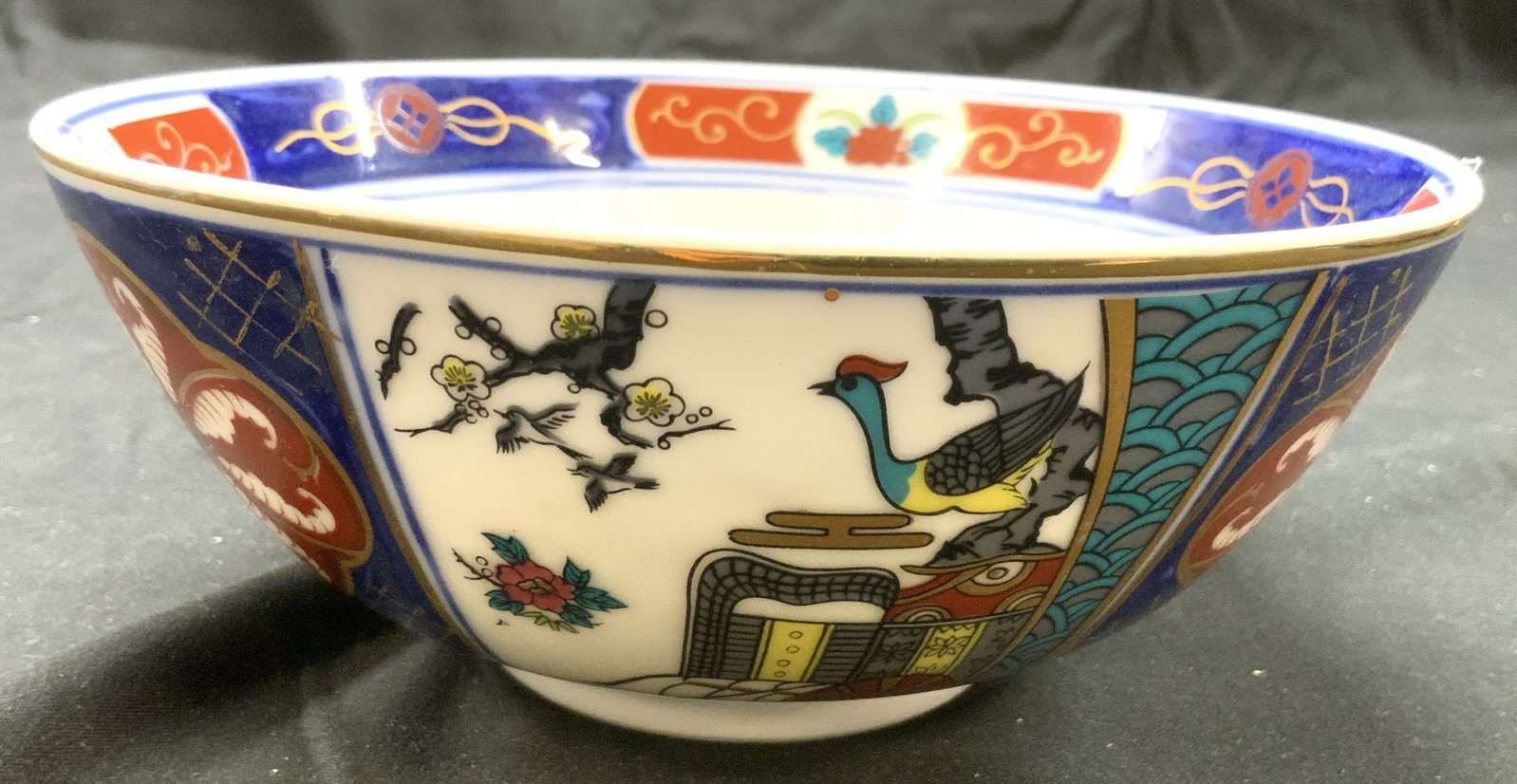 IMARI Vintage Asian Porcelain Bowl JAPAN: Underside is marked IMARI JAPAN. Bowl appears to be hand painted. Piece is white with intricate multi toned floral, leaf, bird, geometric & Gilt detail. Bowl is vintage, piece measures approximately 7