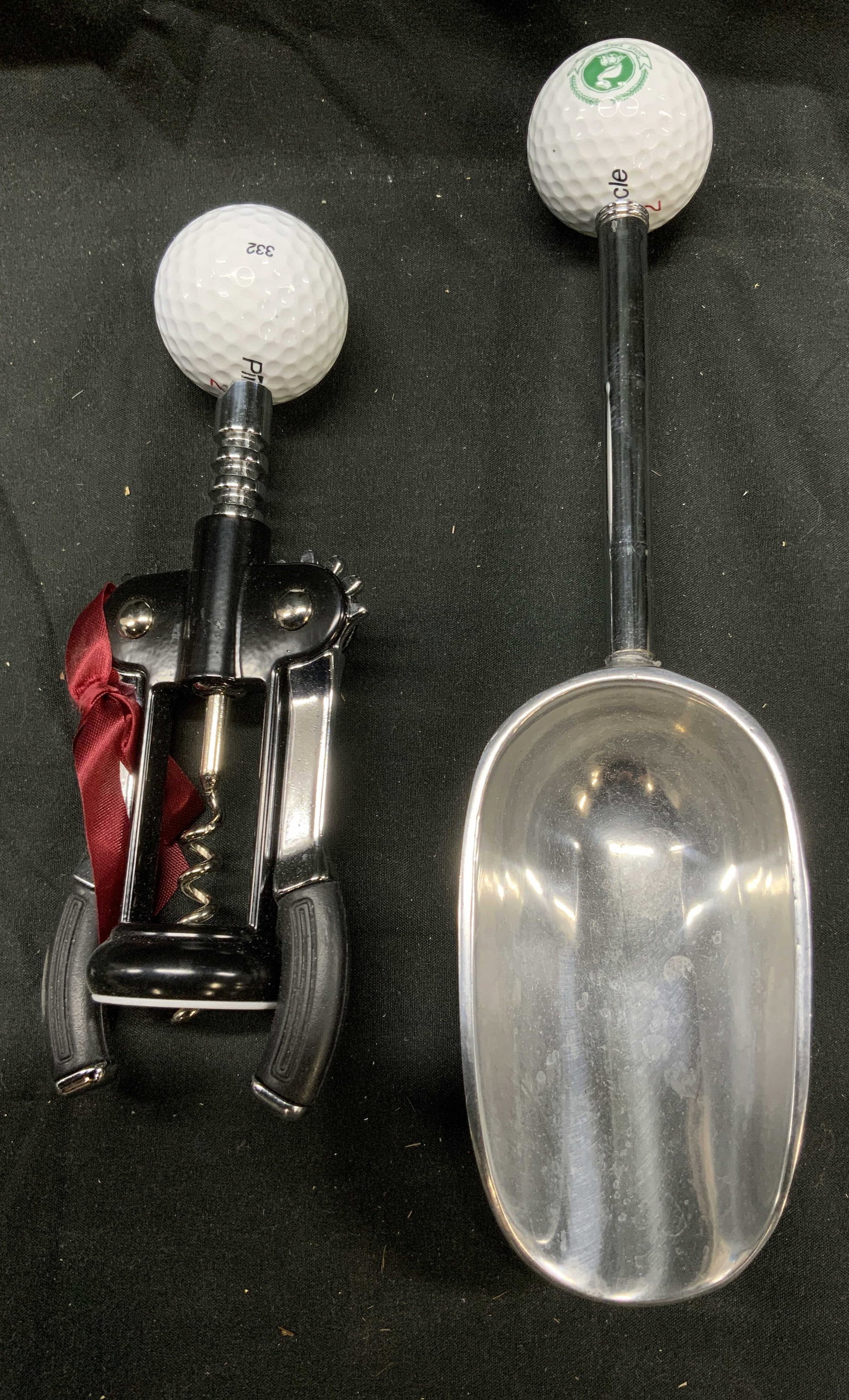PINNACLE Golf Ball Cork Screw & Ice Scoop: Lot includes 1 ice scoop and 1 corkscrew. Each piece has Pinnacle golf ball handles. Ice scoop is metal. Corkscrew is metal and rubber. Ice scoop measures approximately 10.5 inches tall 2.5 inches wid