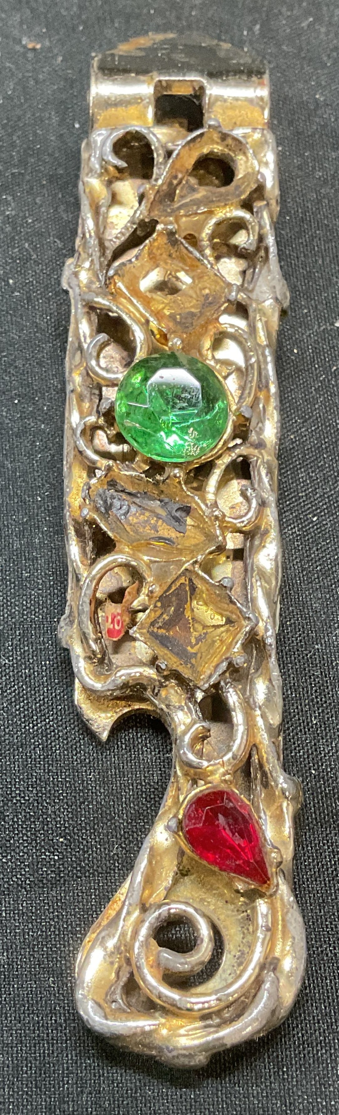 Vaughan Silver Tone Crystal Bottle Opener USA: Vintage Vaughan silver tone bottle opener with crystal decoration. Signed on underside. Made in USA. Measures approx 4.5 x .75 inches. Some crystal need replacement, scratching observed. Bottle opener