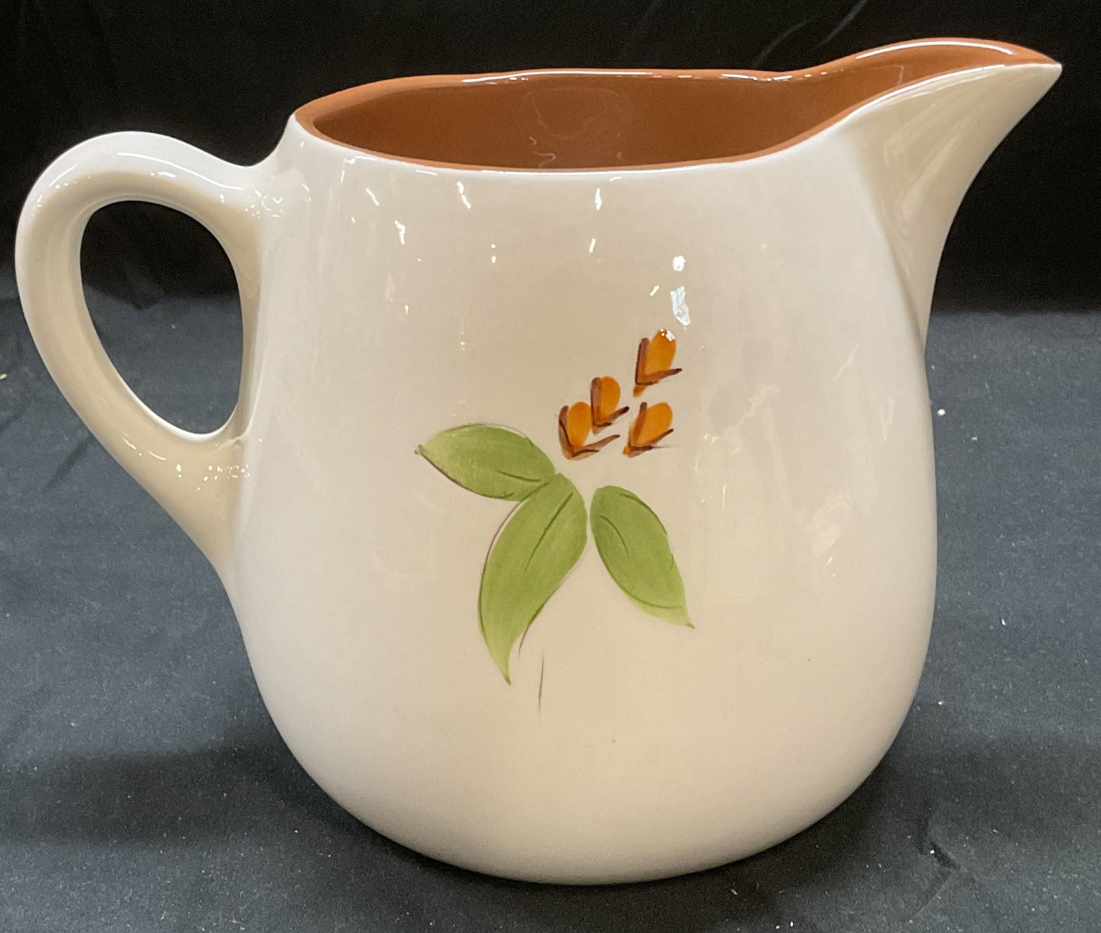 Vintage Stangl Bitter Sweet Ceramic Pitcher: Vintage STANGL ceramic pitcher. Bitter Sweet pattern. Hand painted floral design. Signed on underside. Measures approx 9 x 5.5 x 6.5 inches. Some wear including scratching. Stangl, Stangl pitcher, bit