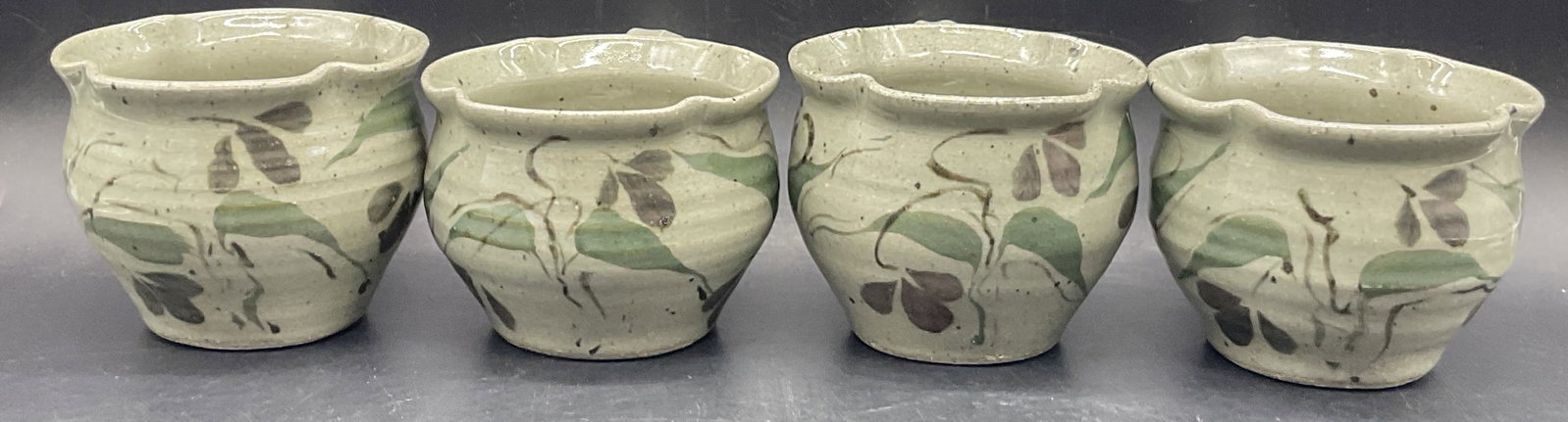 Set 4 Artist Signed Glazed Pottery Mugs: Set of 4 Artist Signed Glazed Pottery Mugs. Undersides are signed. Measures approx. 3.5H x 4W in. Width measured at mouth of mug. Variations in color and size consistent with handcrafting. Crazing, pi