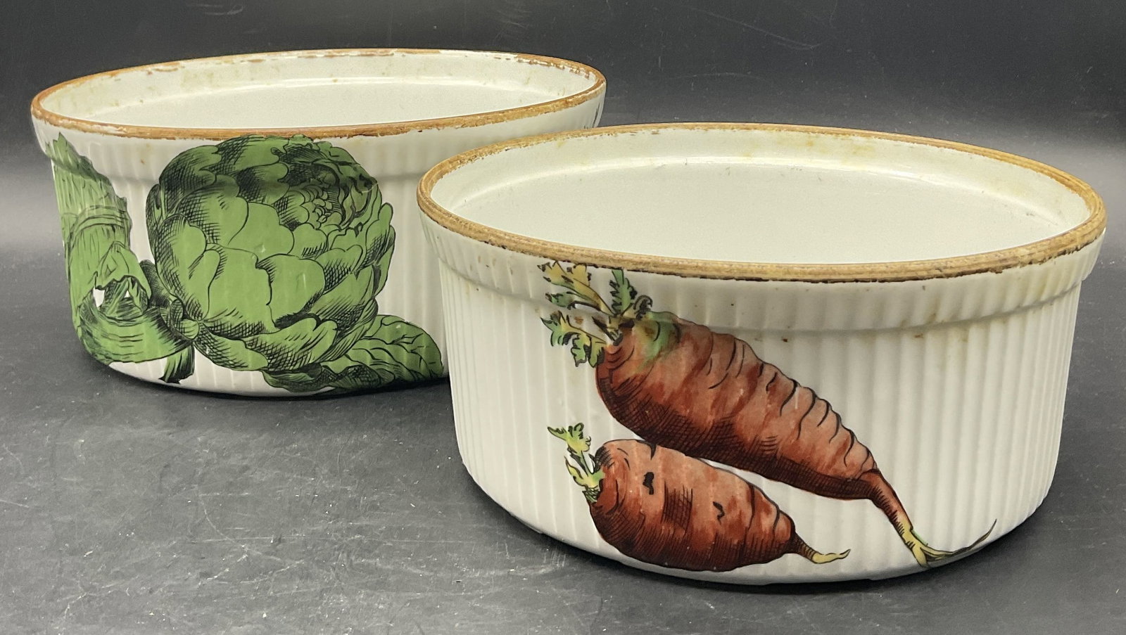 Set 2 PORCELAINE DE PARIS FRANCE Ramekins: Set of 2 PORCELAINE DE PARIS FRANCE Ramekins / Souffle Dishes. Ribbed sides decorated with vegetal motifs. Undersides signed PORCELAINE DE PARIS FRANCE. Larger one measures approx. 3.75H x 8.5W in. Re