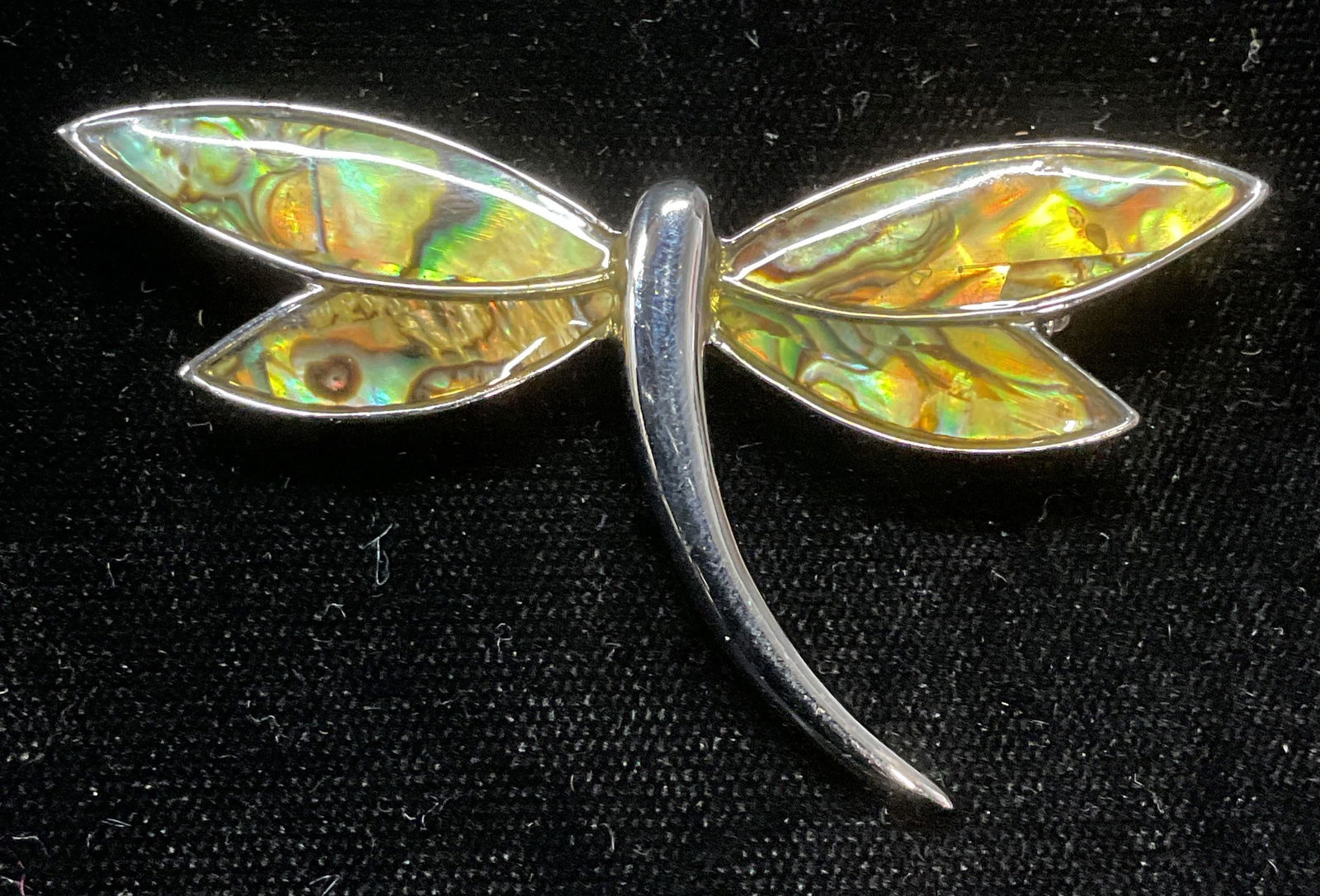 Lia Sophia Silver Tn Shell Dragonfly Brooch: Lia Sophia silver tone dragonfly brooch with shell decoration. Signed on underside. Measures approx 1.5 x 2.5 inches. Some scratching observed. Jewelry, estate jewelry, costume jewelry, cocktail jewel