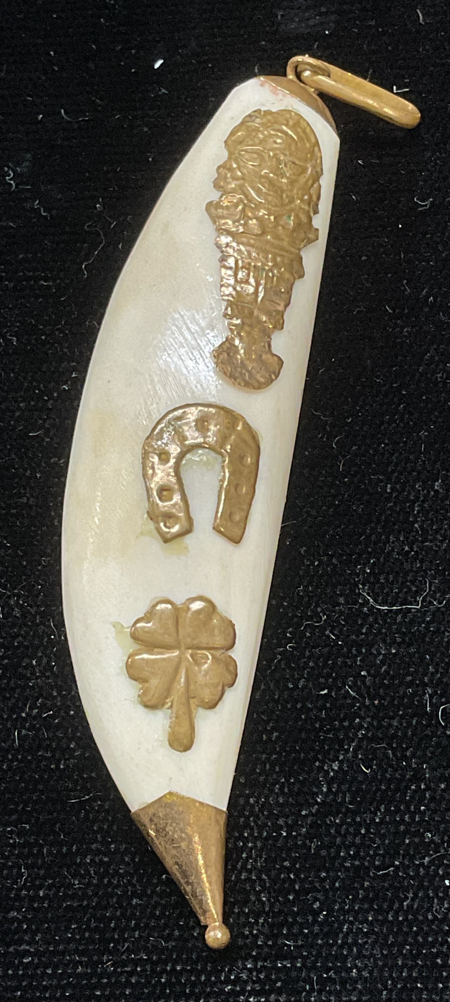 Vintage Claw Brass Pendant: Vintage claw pendant with brass decoration. Horseshoe, clover, figural motifs. Measures approx 2.5 inches long. Some scratching observed. Jewelry, estate jewelry, costume jewelry, cocktail jewelry, fa