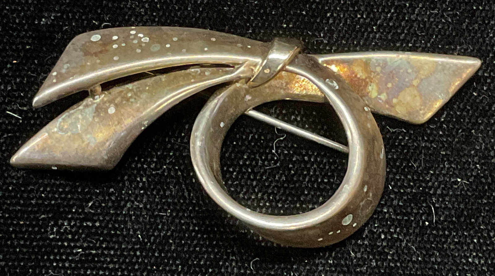 Vintage Sterling Silver Ribbon Brooch: Vintage sterling silver ribbon brooch, marked sterling. Measure approx 1 x 2 inches. Total weight 8 grams. Some scratching observed. Jewelry, estate jewelry, fine jewelry, cocktail jewelry, fashion je