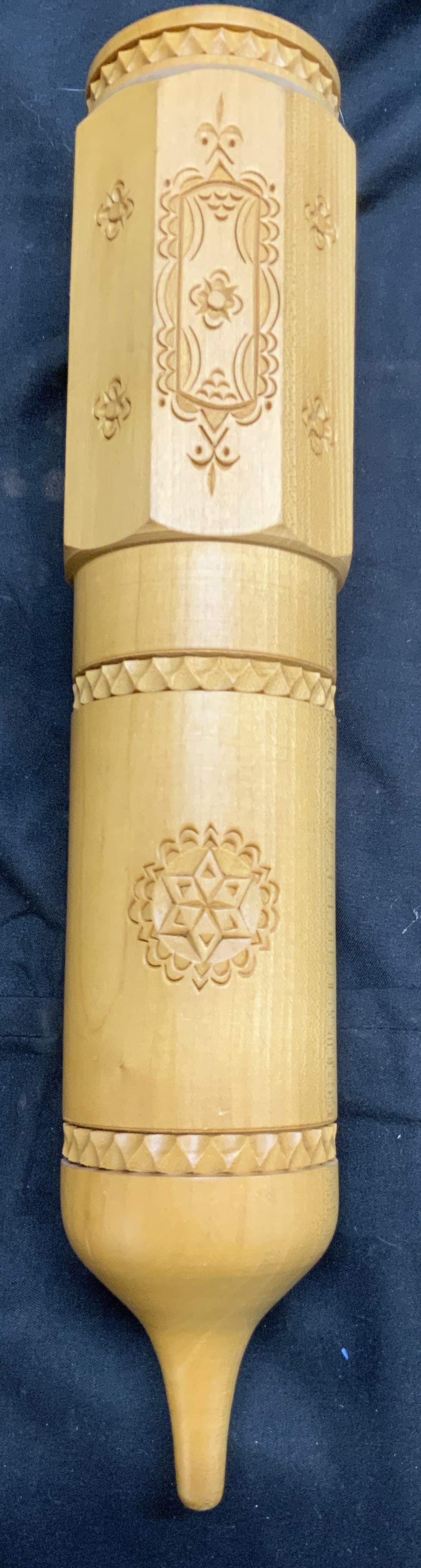 Vintage Southeast Asian Carved Wooden Hanging Vase: Vase is vintage and wooden. Piece is tan toned. Vase has floral & geometric relief detail. Underside is pointed. Southeast Asian wooden hanging vase. Piece measures approximately 12.5 inches tall 2.5 
