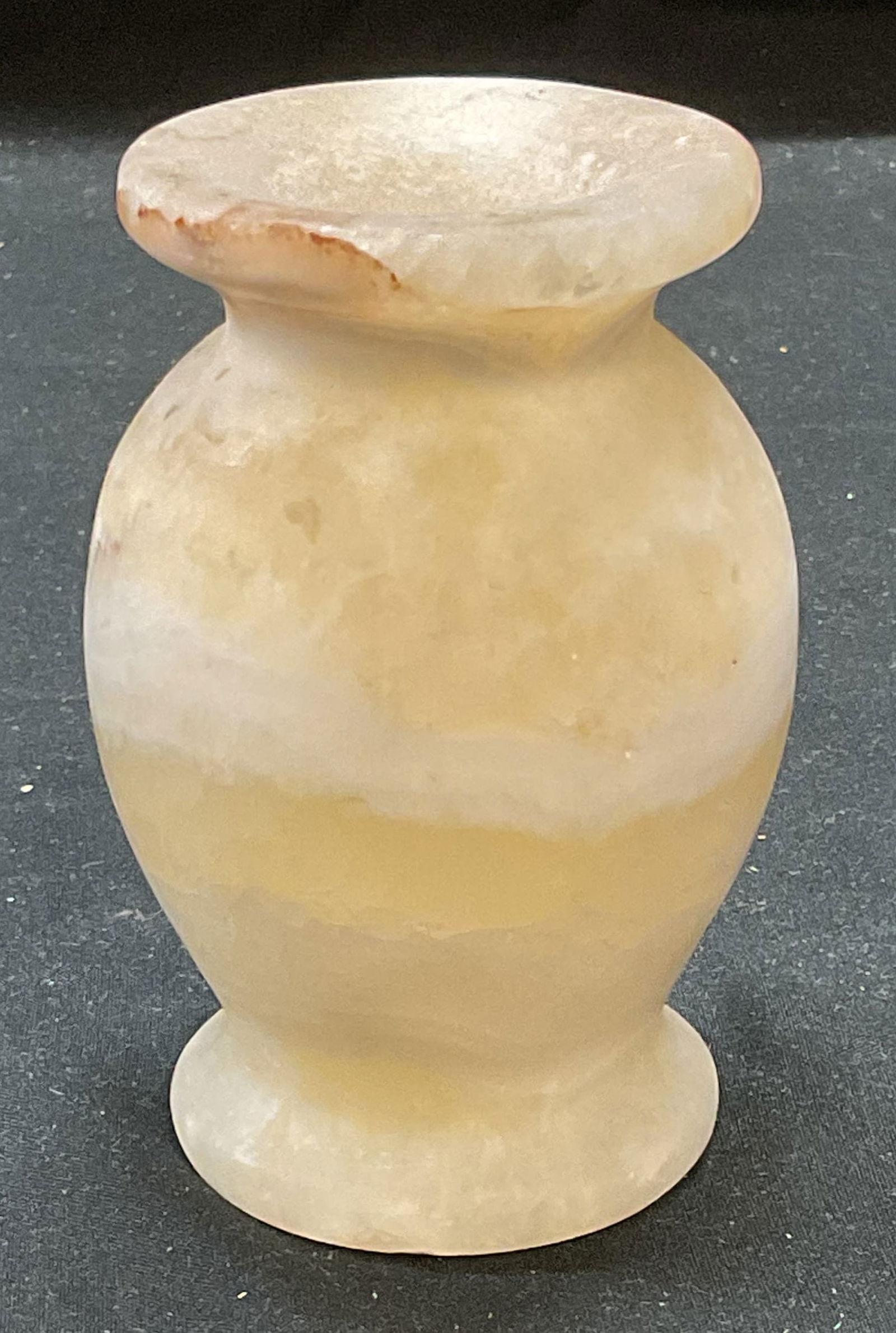 Carved White Alabaster Vase, Egypt: Carved white alabaster stone vase. Made in Egypt. Piece has weight. Measures approx 2.5 x 4 inches. Some scratching observed. Alabaster vase, white vase, stone vase, carved stone vase, home decor, hom