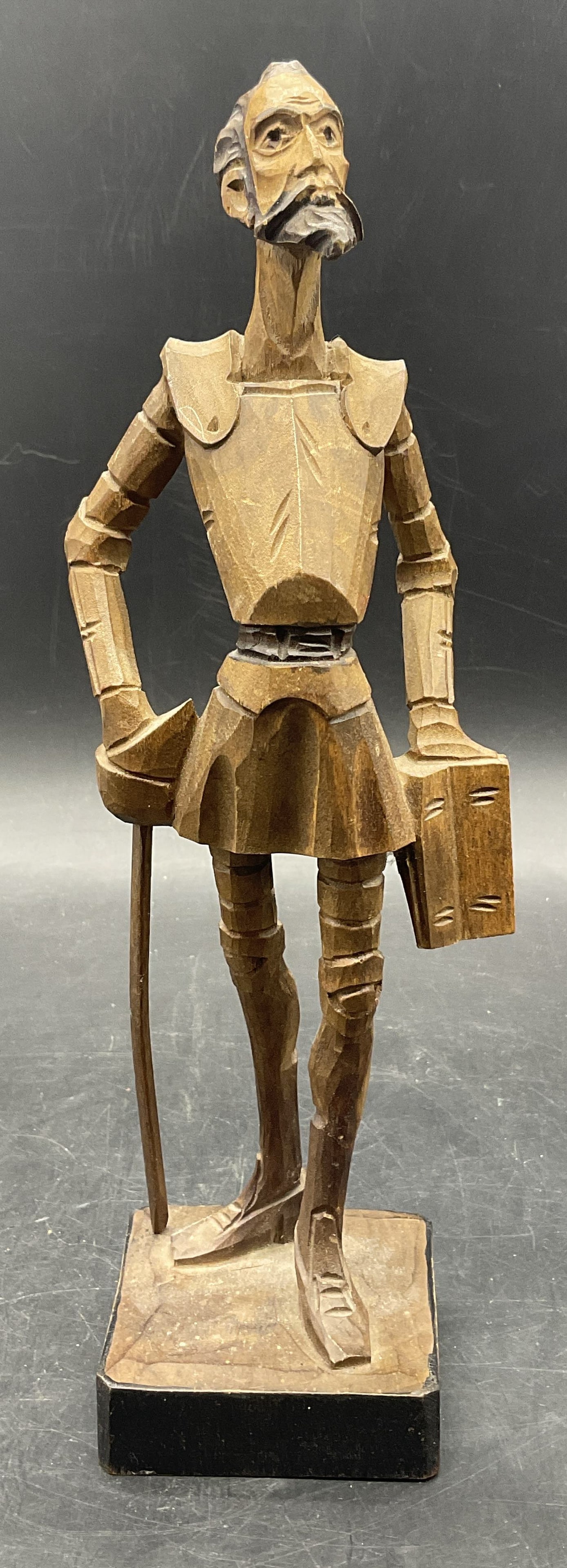 1984 OURO ARTESANIA Carved Wood Don Quixote Fig: 1984 OURO ARTESANIA Carved Wood Don Quixote Figural. Underside reads Oct. 1984, OURO ARTESANIA, Made in Spain. Measures approx. 10.5H x 3W in. Measured at widest point. Surface wear and chipping prese