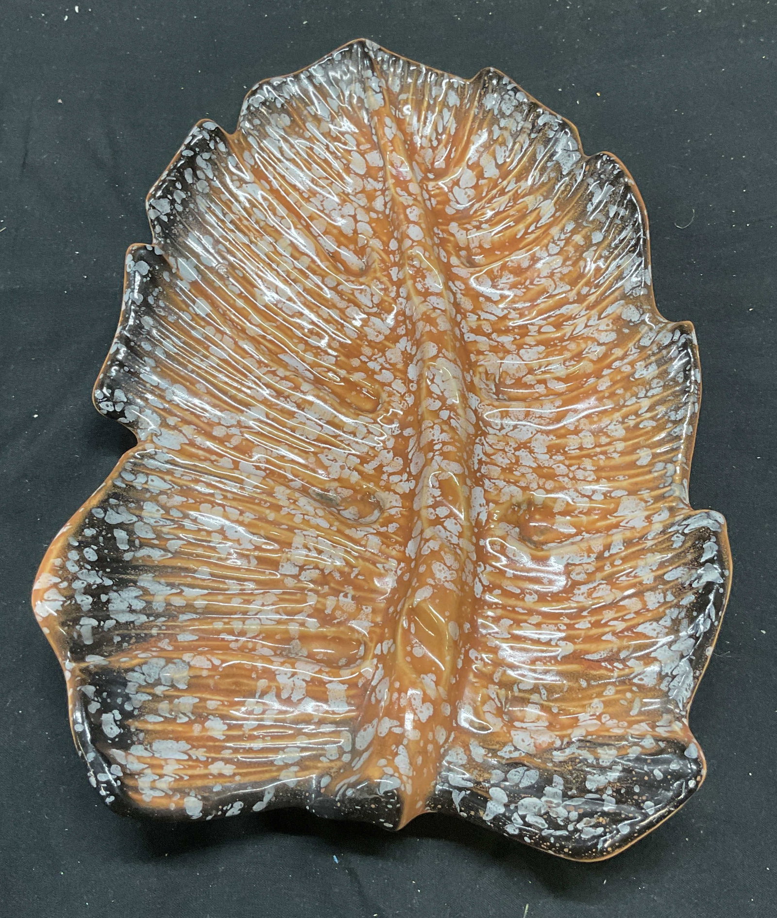 Vintage Orange Art Pottery Feather Plate: Vintage orange and black art pottery feather motif plate. Measures approx 10 x 7 inches. Some scratching observed. Feather plate, art pottery plate, orange plate, homewares, home decor, home accessori