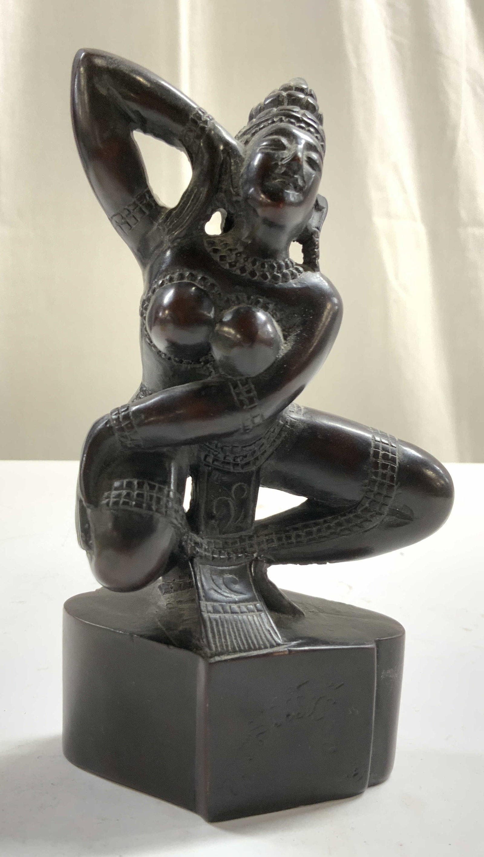 Balinese Vintage Deity Figure: figure is vintage, appears to be resin. Piece depicts a Balinese Deity figure. Figure is brown toned. Piece has intricate relief detail. Figure measures approximately 6 inches tall 3.5 inches wide 2.5