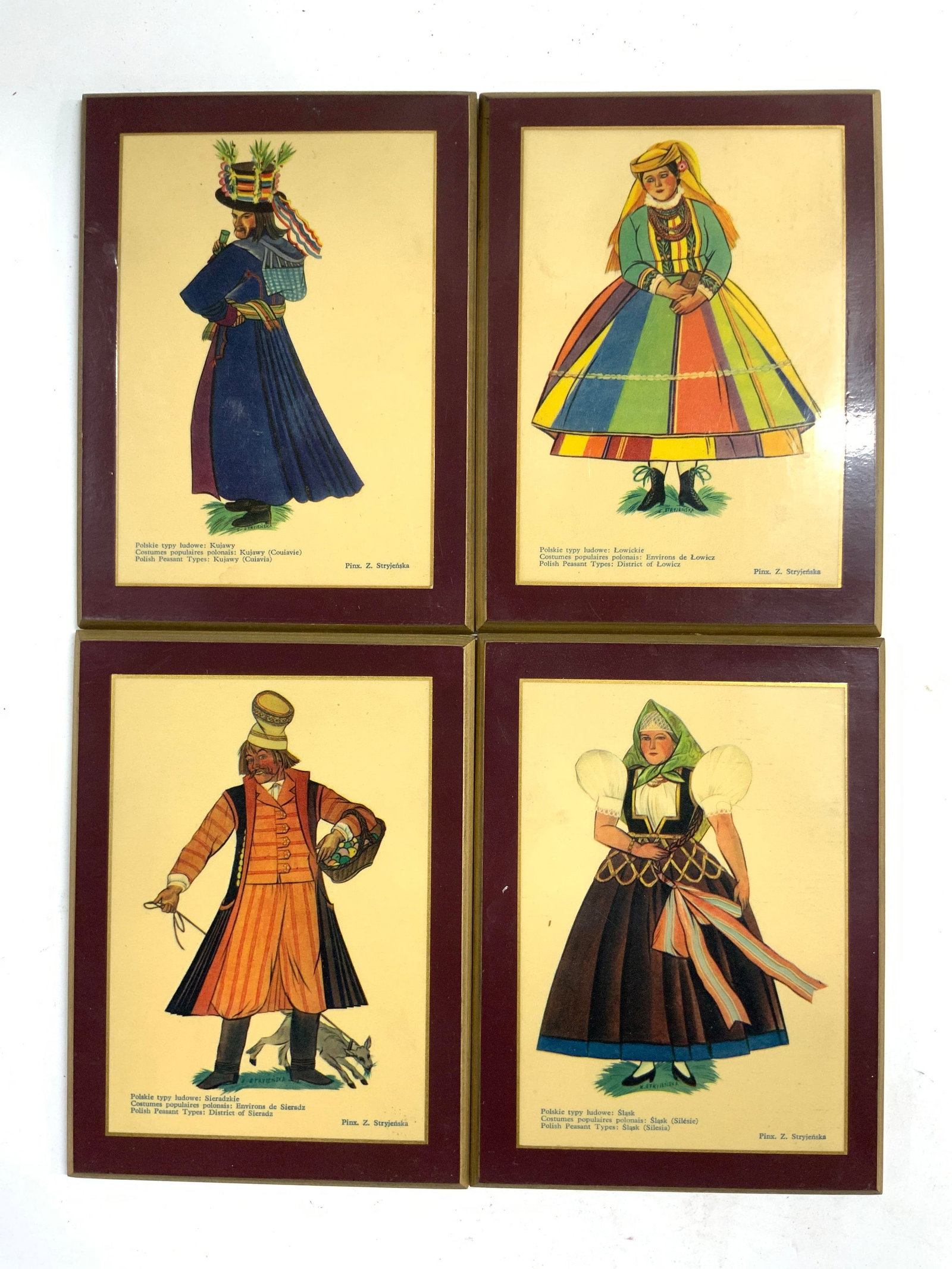 ZOFIA STRYJENSKA 4 Polish Folk Art Costume Prints: Each print read Z STRYJENSKA on lower right corners. Each depict figures wearing traditional & costume outfits. Each are on board. Pieces are each vintage. Polish folk art. Each piece measures approx 
