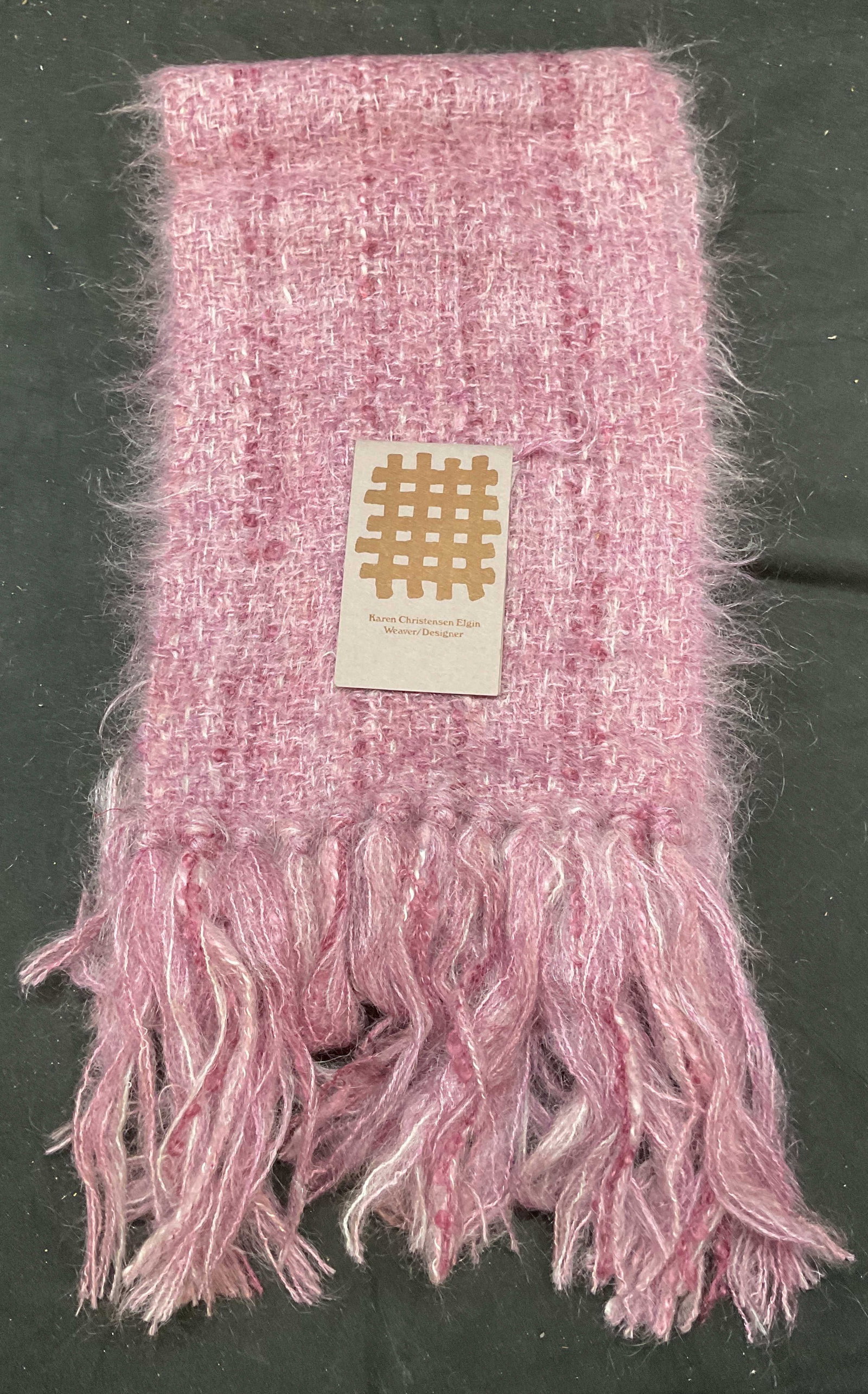Karen Elgin Purple Mohair Wool Woven Scarf: Karen Christensen Elgin purple woven fringe scarf. Wool, mohair, acrylic. Measures approx 58 inches long. Wear including rubbing and pulling. Mohair scarf, wool scarf, woven scarf, Karen Christensen E