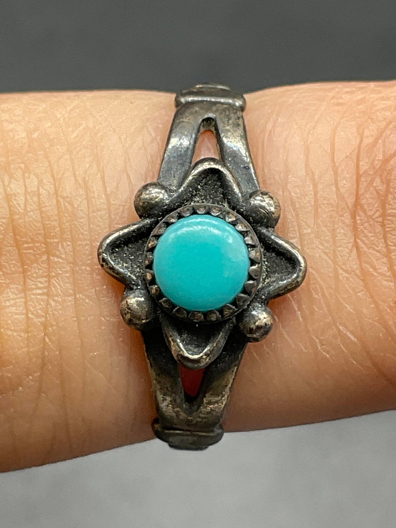 STERLING SILVER Trademarked Blue Stone Ring: Turquoise hued blue stone sterling silver ring. Trademarked on the band interior and marked STERLING. Ring size is approx. 5. Total weight .06 ozt. Surface wear consistent with age, use, and exposure.