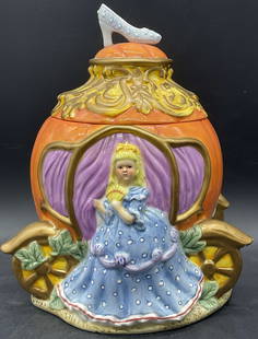 LDT Cinderella Pumpkin Carriage Ceramic Cookie Jar: LDT Cinderella with Pumpkin Carriage Ceramic Cookie Jar. Lidded. Underside sticker reads LDT. Measures approx. 10.5H x 8W in. Measured at widest point. Crazing, chipping, wear to paint, and