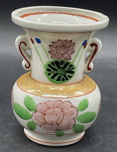 Vintage Hand Painted Floral Motif Porcelain Vase: Vintage Hand Painted Floral Motif Porcelain Vase. White vase decorated with red, blue, green, black, pink, and Lusterware. Measures approx. 4.5H x 3.25W in. Width taken at the mouth of the vase.