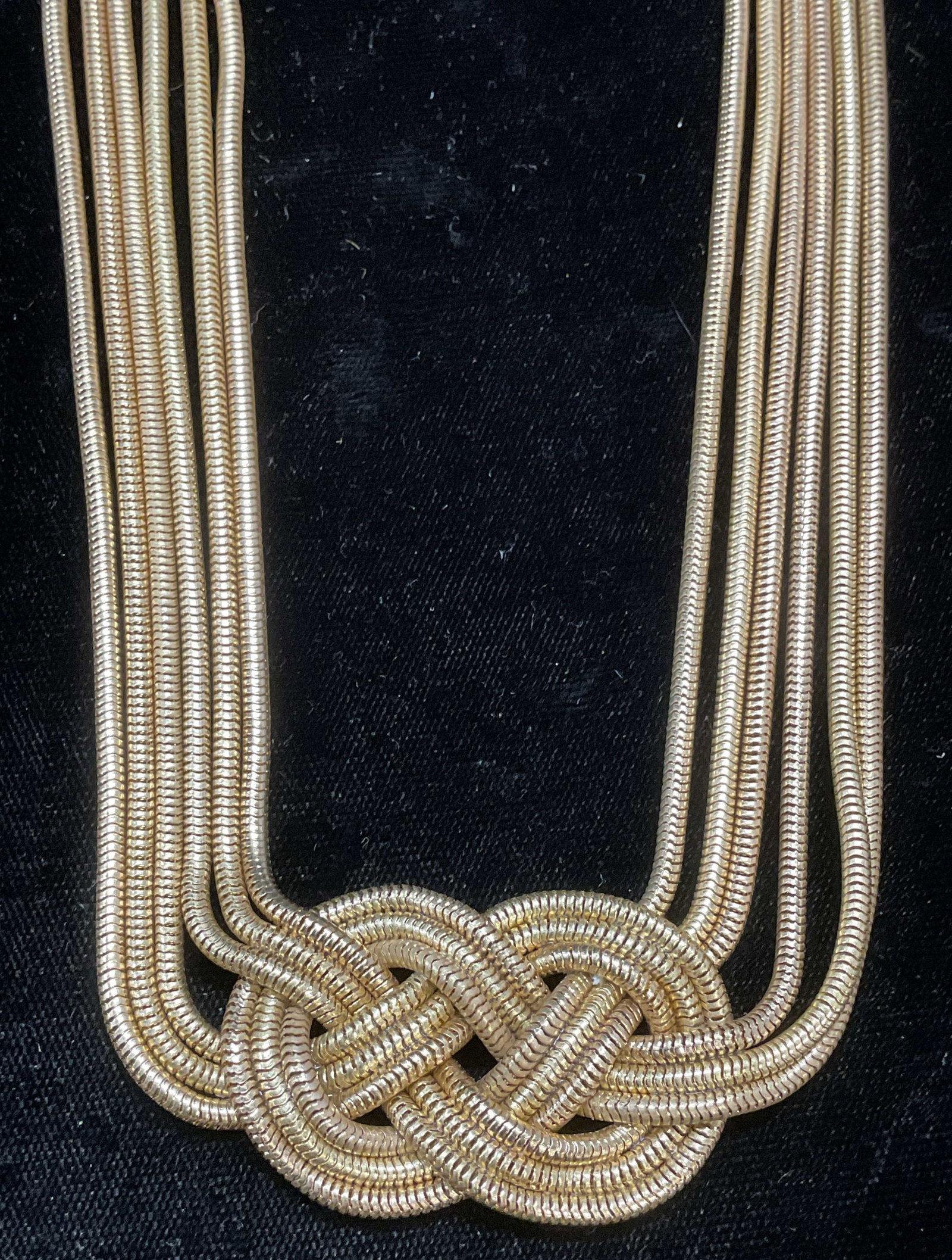 Signed MW Gold Tn Chain Pendant Necklace: Signed MW gold tone multi chain necklace with knot pendant. Drop length approx 10.5 inches. Some wear including scratching observed. Jewelry, estate jewelry, costume jewelry, cocktail jewelry, fashion