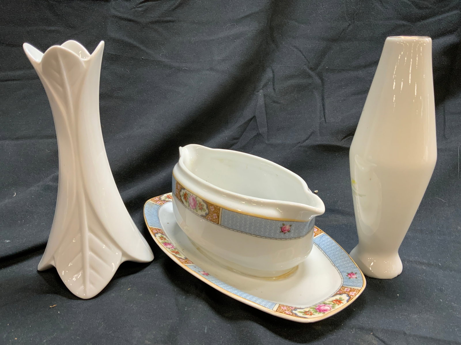 Lot3 Porc Gravy Boat & Vases LIMOGES France & More: Underside of one vase is marked LIMOGES FRANCE. Underside of gravy boat is marked CROWN CHINA MADE IN CZECHOSLOVAKIA. Gravy boat has floral, leaf & geometric detail near edges. Gravy boat measures app