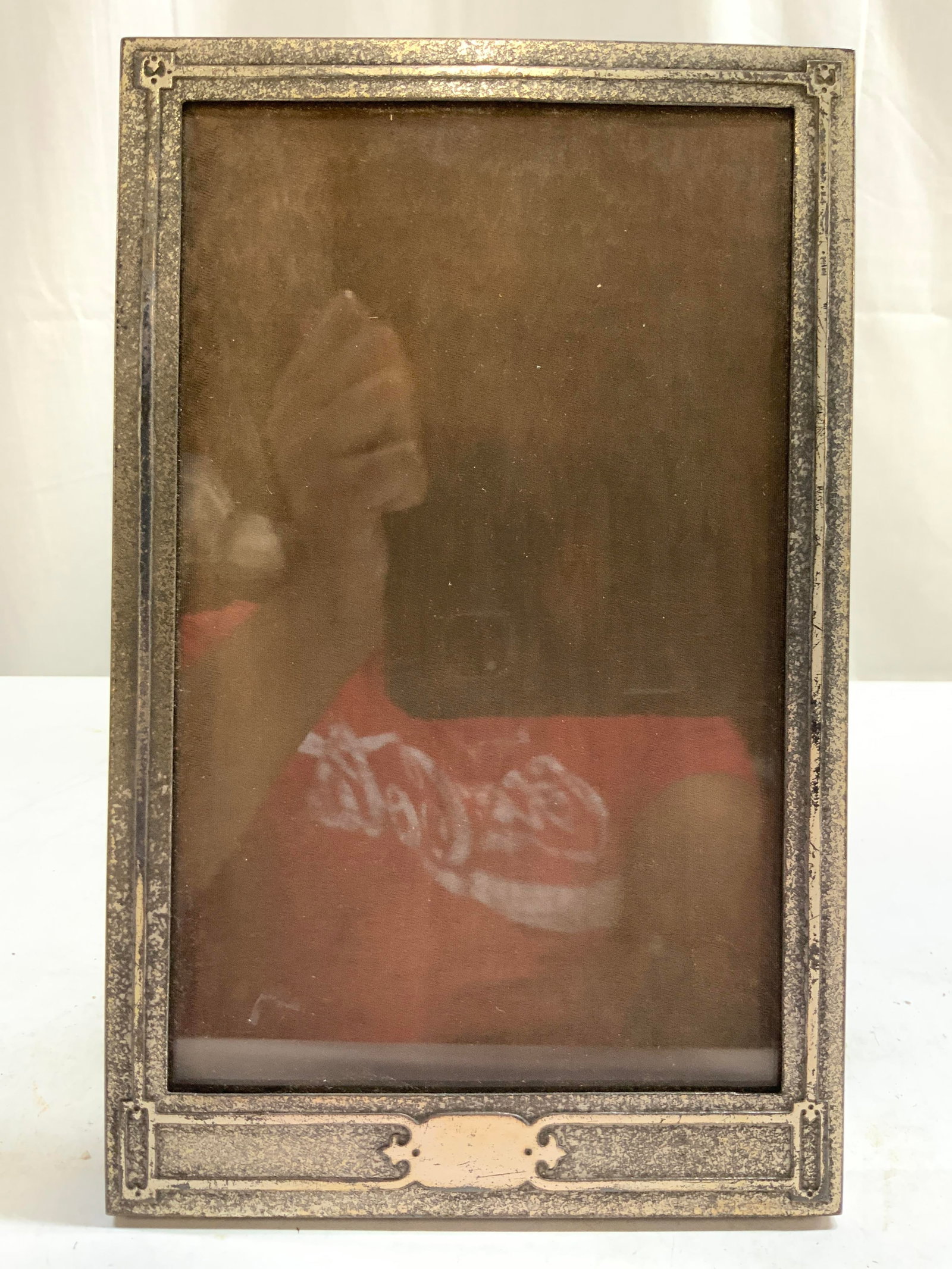 Vintage Standing Metal Photo Frame: Underside inscribed 2358-8. Frame is vintage. Piece is silver toned and metal. Frame has stand on backside. Backside is light brown toned. Frame measures approx 9.5 inches tall 6 inches wide (window 7