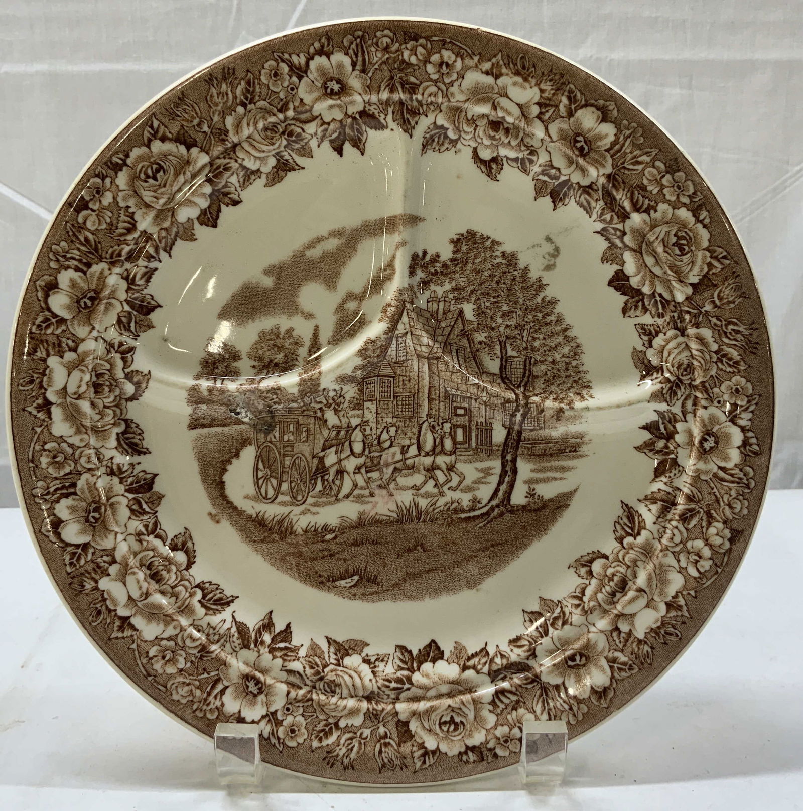 SHENANGO Transferware Horse Scenic Ceramic Plate: SHENANGO Transferware Horse Scenic Ceramic Plate Plate has a divided design with a central scene of horses with carriages in front of a building. Trim of plate has a floral border. Signed & marked by