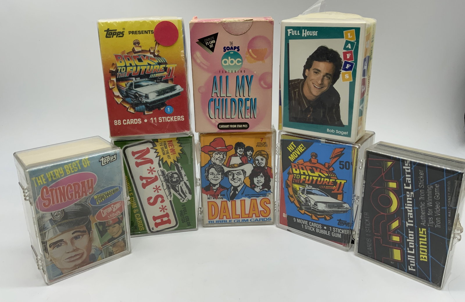 Lot 50+1980s Back to the Future, MASH Trading Crds: Lot 50+1980s Back to the Future, MASH Trading Crds Group lot 50+ trading cards of Back to the Future, Dallas, Mash, Tron, Stingray, All My Children & Full House. Each card has its own distinctive illu