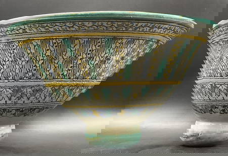 Vintage Handcrafted Moroccan Ceramic Bowl: Vintage Handcrafted Moroccan Ceramic Bowl. Measures approx. 7.25H x 13W in. Painted blue, yellow, and black hues. Chipping, losses, and pitting present. Wobble to piece. home decor, home accents, home