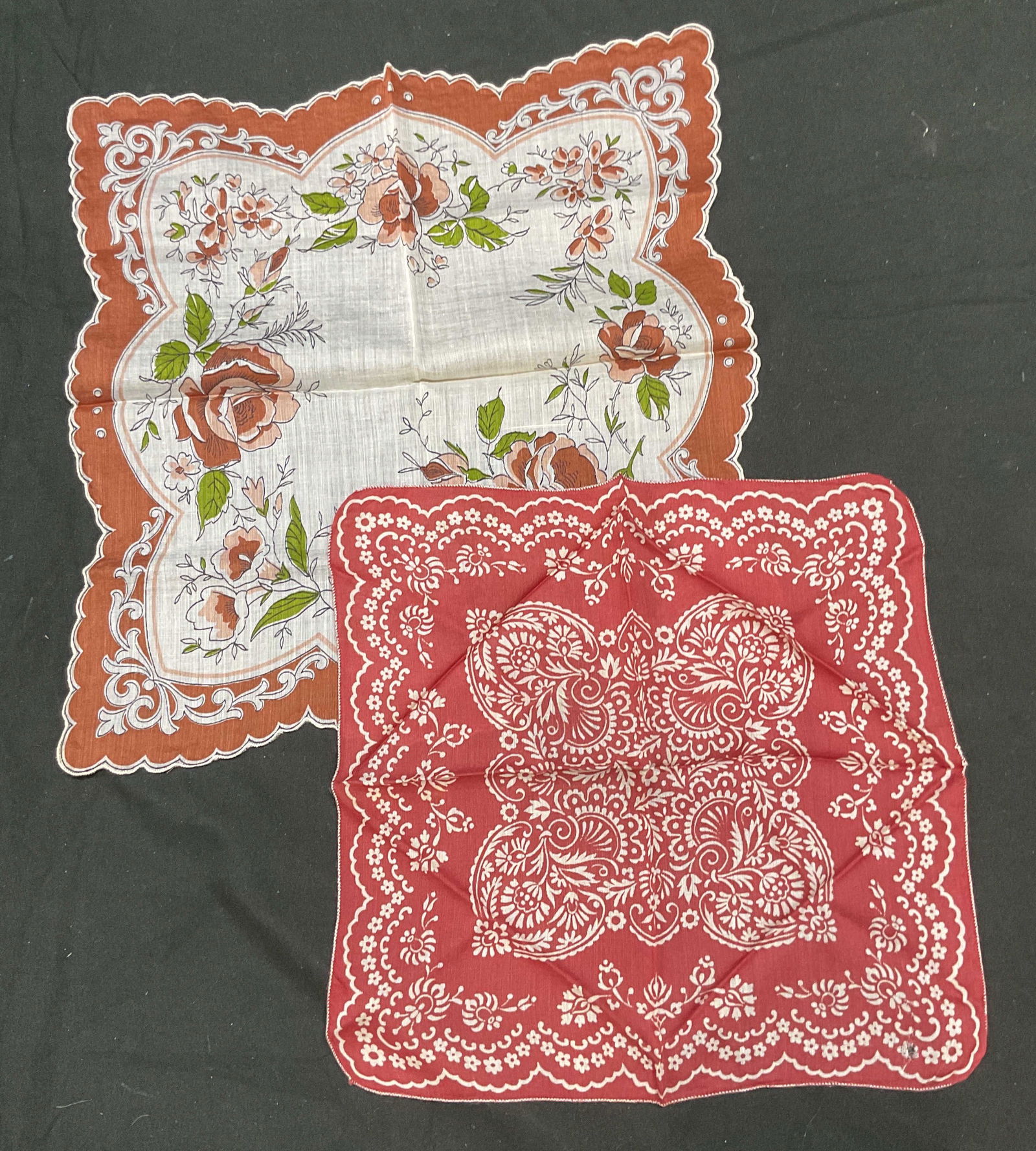 Lot 2 Vintage Red Floral Handkerchiefs: Lot of 2 vintage red and white floral print handkerchief. Cotton. Larger measures approx 12 x 12 inches. Some wear to each consistent with exposure. Handkerchief, collectible handkerchief, vintage han