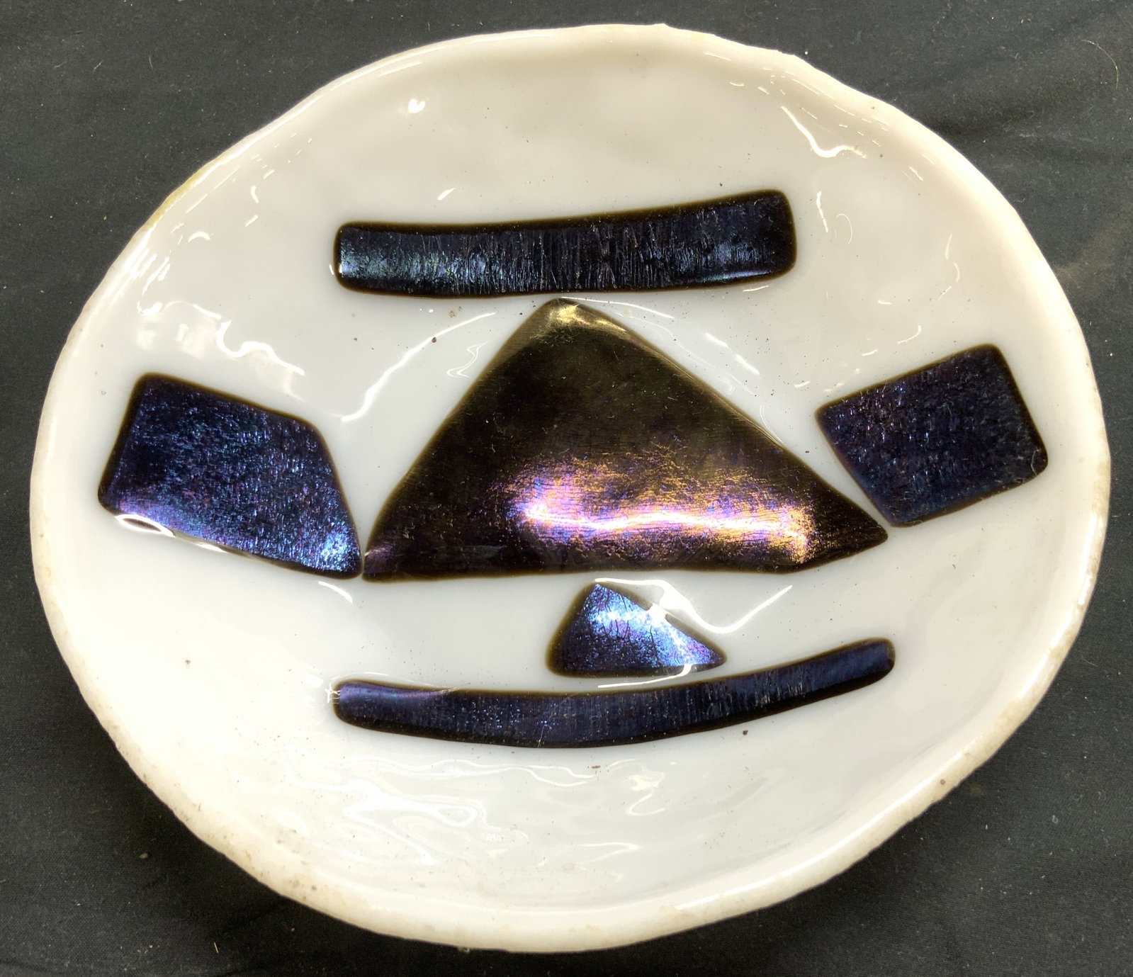 KIRK 2014 Art Glass Bowl Vessel: Bowl appears to be KIRK 2014. No apparent markings. Vessel is white with violet toned geometric detail with shine and brushed luster. Bowl is glass. Piece measures approximately 7.25 inches wide 1.5 i