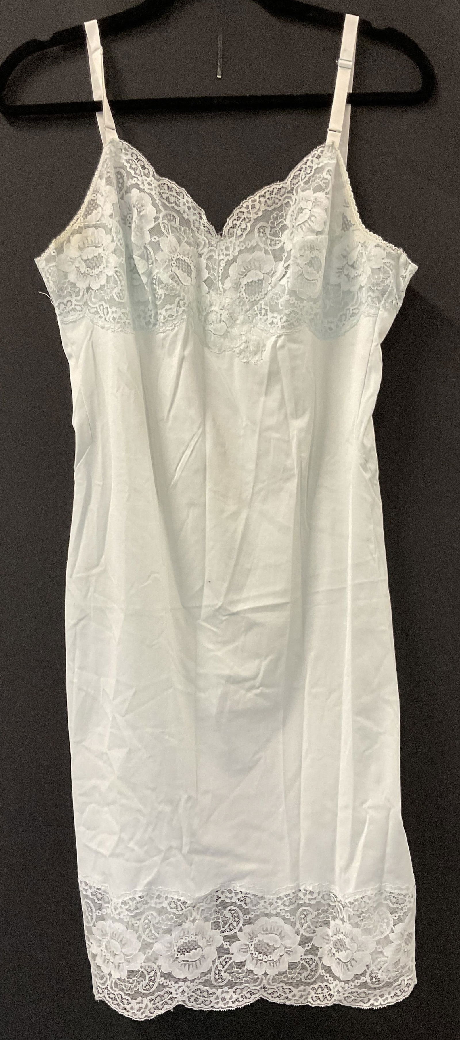 Vintage Light Blue Lace Trim Slip Dress: Vintage Light Blue Lace Trim Slip Dress. Crafted from soft hand material. Measures approx. 39L x 13W in. Measured flat. Length includes straps. Width measured across the chest. Surface wear, loose thr