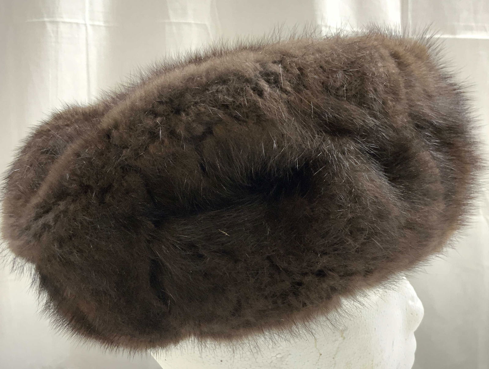 Trademarked Mink Fur Winter Hat Brown: Interior is trademarked with Russian characters. Piece is brown toned, appears to possibly be mink fur. Winter hat measures approximately 9 inches wide 4 inches tall. Hat, winter hat, brown hat, headw