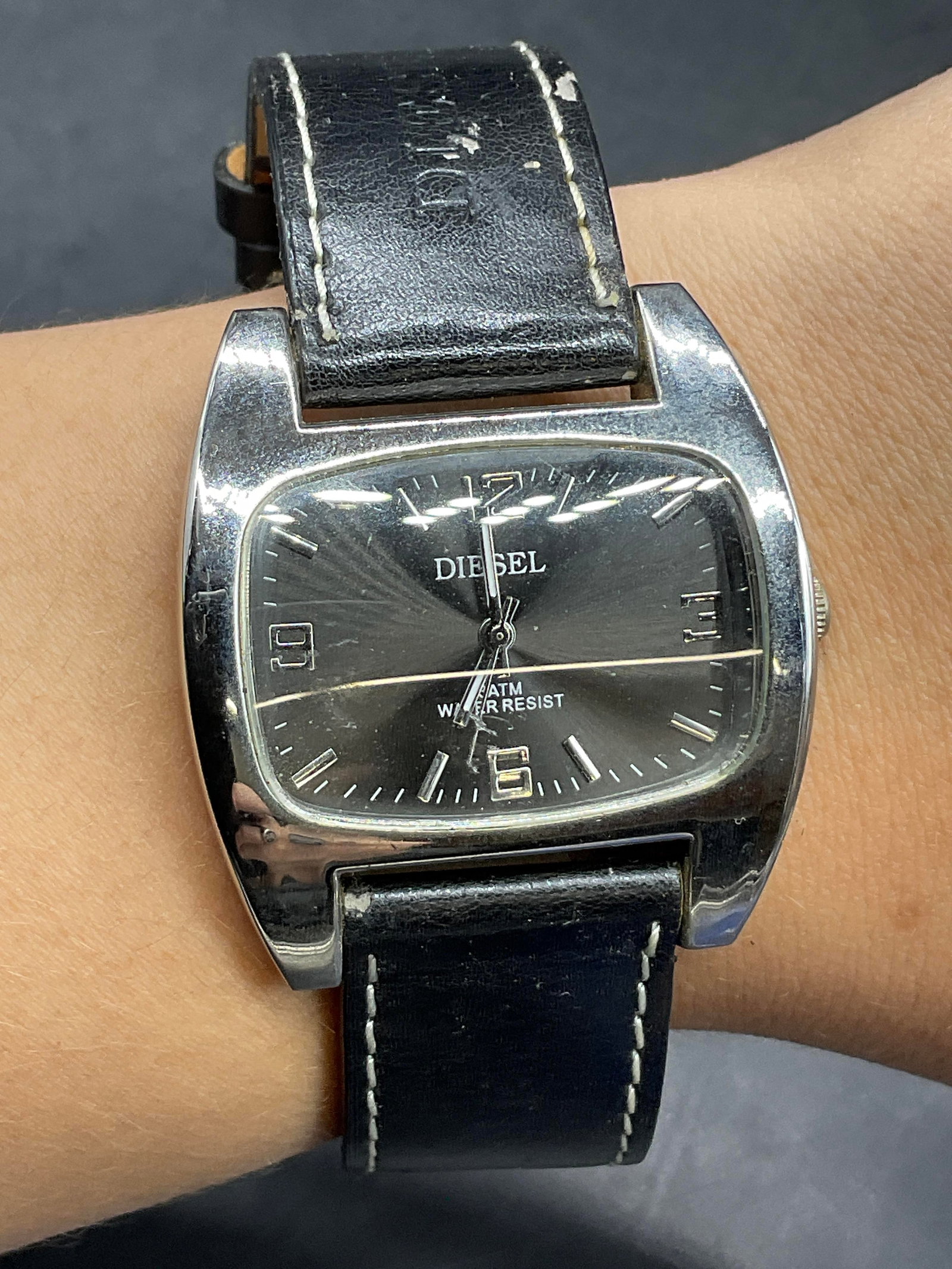 DIESEL Water Resistant Black Leather Wristwatch: DIESEL Water Resistant Black Leather Wristwatch. Stainless steel backed watch with a genuine leather band. Length measured end to end approx. 9 inches. Not tested for function. Warping, losses, and su