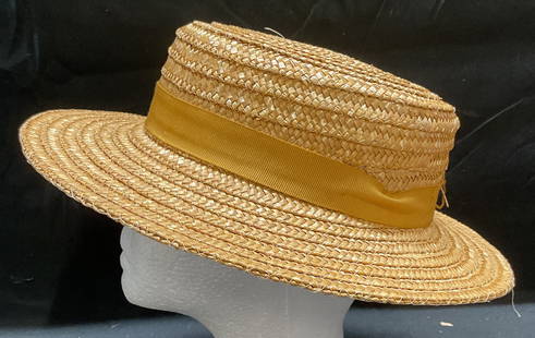 Saks Fifth Avenue Woven Straw Hat, Italy: Saks Fifth Avenue woven straw hat. Made in Italy. Measures approx 7 inches wide. Some wear to material consistent with exposure. Saks fifth Avenue hat, designer hat, designer accessories, woven straw
