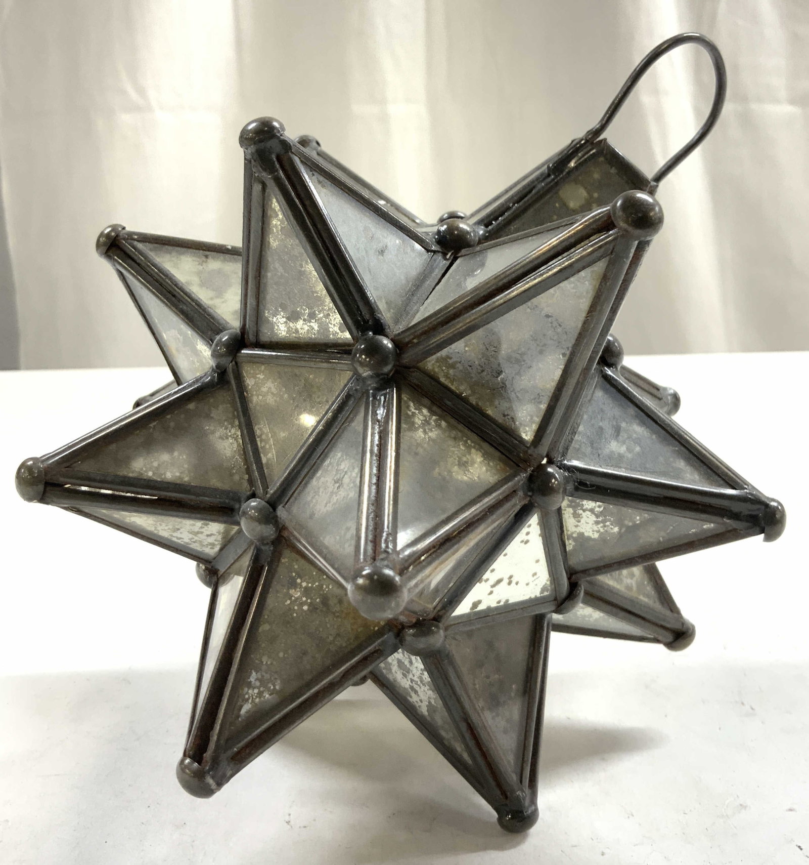 Vtg Moravian Star Glass & Metal Candle Holder: Candle holder is vintage. Piece is glass and metal. Moravian star candle holder. Piece has area at top to hang. Piece measures approximately 7.5 inches tall 5.5 inches wide. Candle holder, Moravian st
