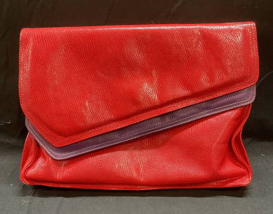 Vtg Bloomingdales Red Snakeskin Clutch Italy: Vintage Bloomingdales red and purple snakeskin embossed leather clutch. Made in Italy. Measures approx 7.5 x 10 x 2 inches. Corner wear, rubbing, loss to shape observed. Bloomingdales handbag, leather